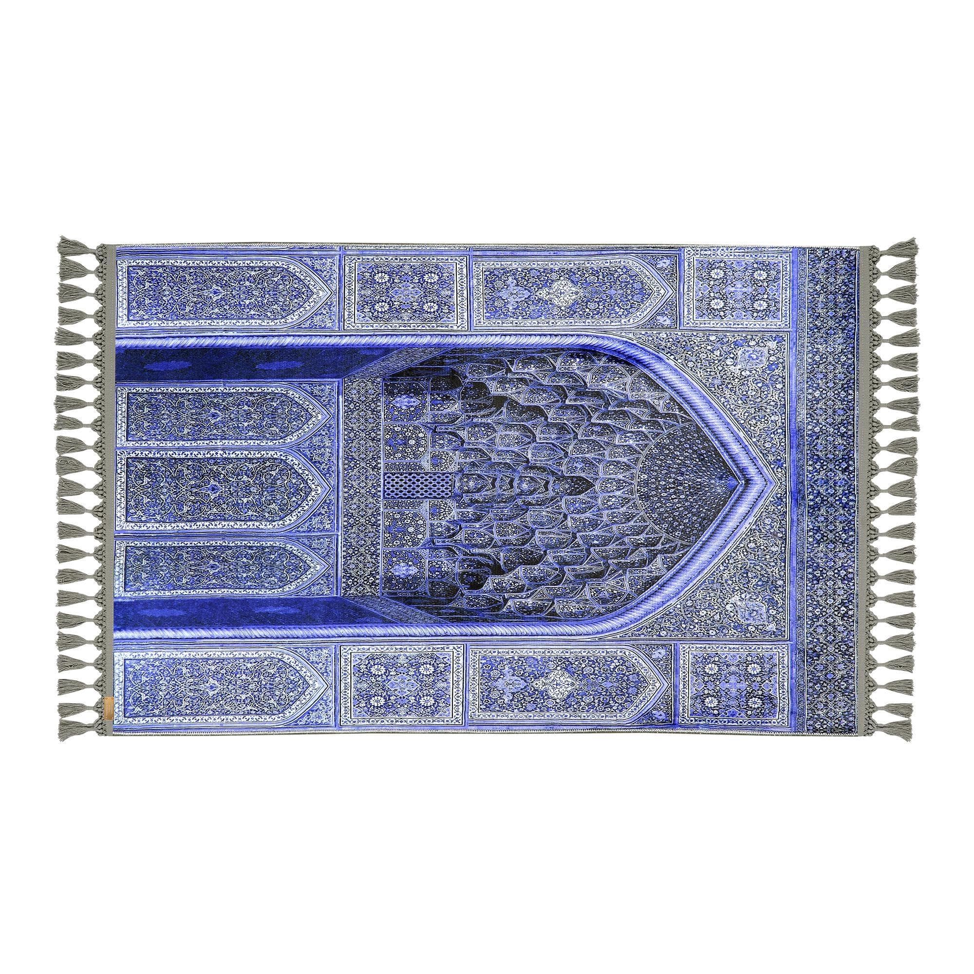 Turkish prayer rug with a blue Ottoman mihrab design, made of soft cotton woven base with non-slip backing. Soft texture. Measures 80x125 cm (31.5"x49.2"), 7 mm thick, and weighs 1.738 kg. Inspired by traditional Ottoman patterns, it reflects elegant Islamic style with hand-knotted fringes. Ideal for daily prayers at home, travel, or mosque. A meaningful Islamic gift — suitable for weddings, Ramadan, Eid, or Hajj. Optional name printing and custom sizing available.