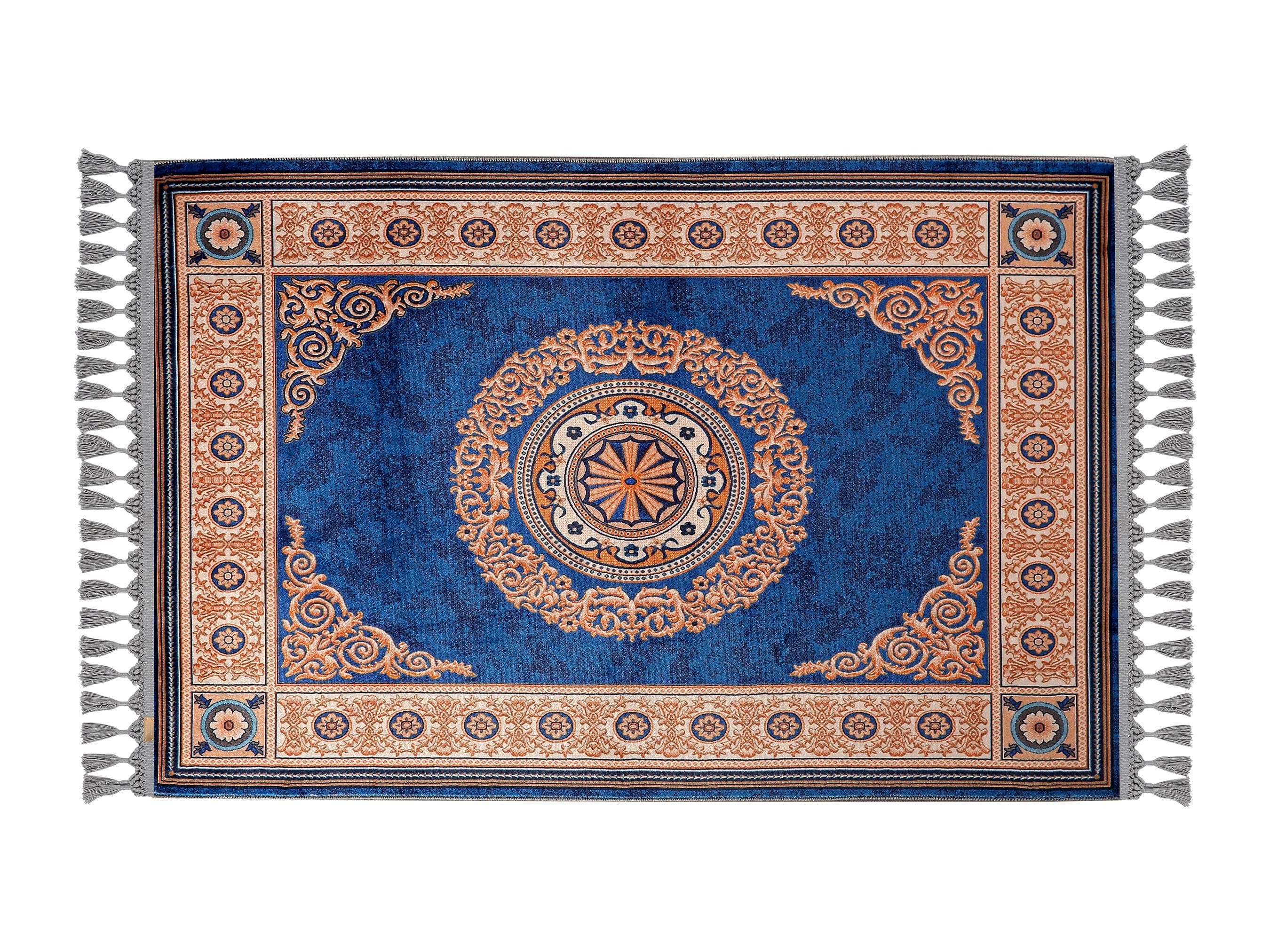 Turkish prayer rug with a dark blue and ash grey medallion and bordered design, made of soft cotton woven base with non-slip backing. Measures 80x125 cm (31.5"x49.2"), 7 mm thick, and weighs 1.738 kg. Inspired by traditional Turkish carpet motifs, it showcases elegant Islamic style with hand-knotted fringes. Ideal for daily prayers at home, travel, or mosque. A meaningful gift for weddings, Ramadan, Eid, or Hajj. Optional name personalization and custom sizing available.