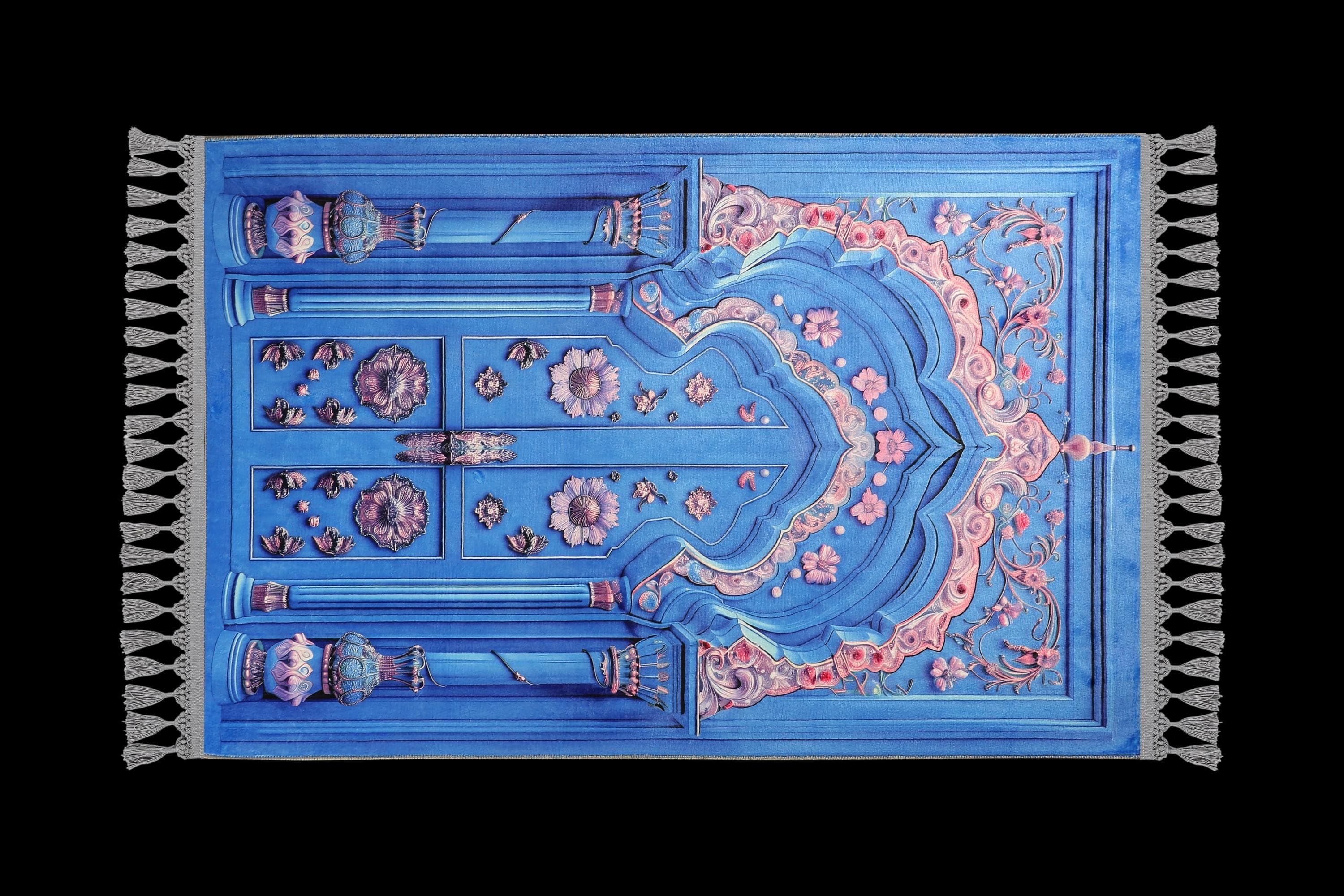 Turkish prayer rug with a blue and pink door-shaped mihrab design, made of soft cotton woven base with non-slip backing. Measures 80x125 cm (31.5"x49.2"), 7 mm thick, and weighs 1.738 kg. Inspired by Ottoman doorway architecture and Islamic prayer niche forms, it showcases elegant style with hand-knotted fringes. Ideal for daily prayers at home, travel, or mosque. A meaningful gift for weddings, Ramadan, Eid, or Hajj. Optional name personalization and custom sizing available.