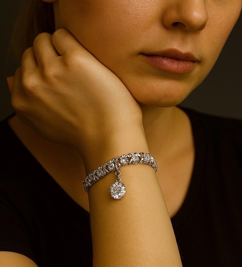 AI created image for a model wearing the vintage 1980s XO tennis bracelet in 925 sterling silver with cubic zirconia stones and drop charm.
