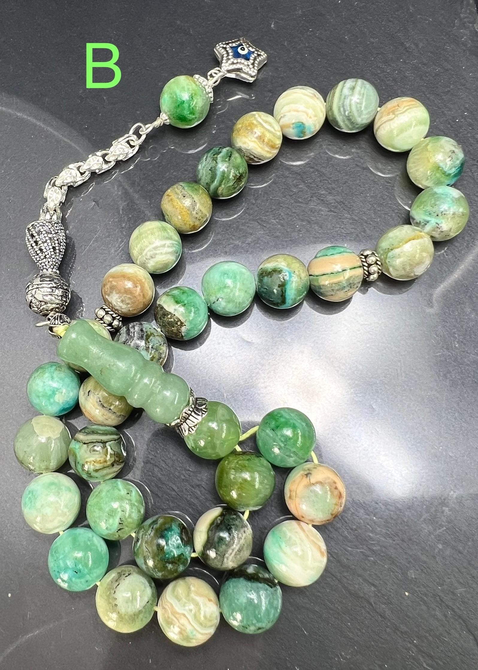 Natural Phoenix Jade Tasbih with 33 beads, handmade with 925 sterling silver tassel. Ideal for Ramadan, Eid al-Adha, AkueShop, spiritual healing, heart chakra energy.