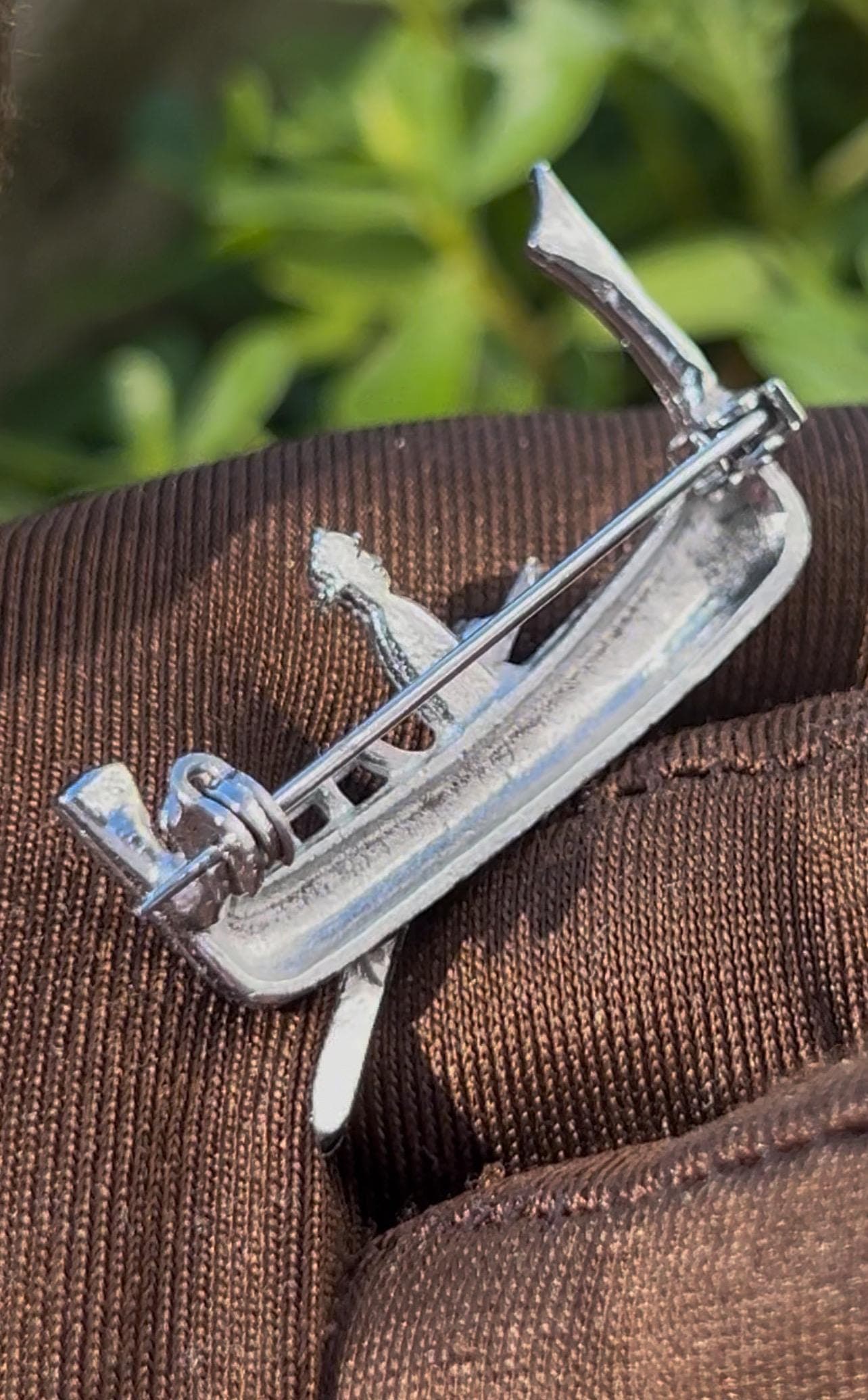 Vintage gondola brooch from the 1990s. Crafted in silver tone metal and adorned with natural marcasite stones
