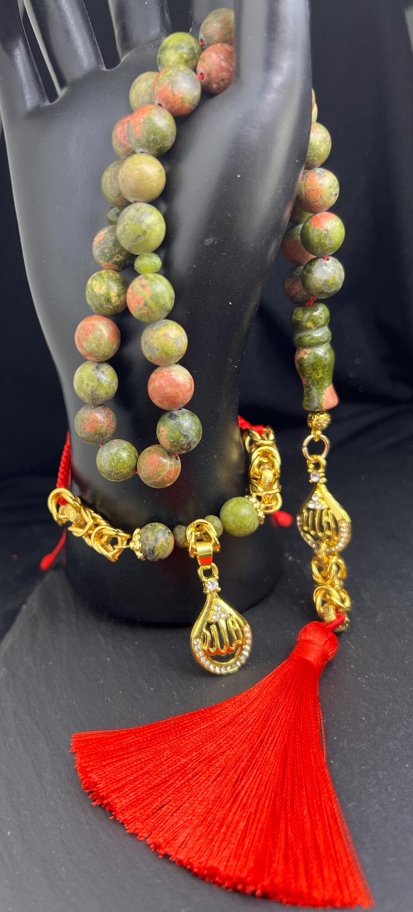 Unakite Tasbih – 33 natural stone beads (10 mm) with a gold-plated 'Allah' pendant. Perfect for spiritual energy, meditation, or as an elegant gift for special occasions.