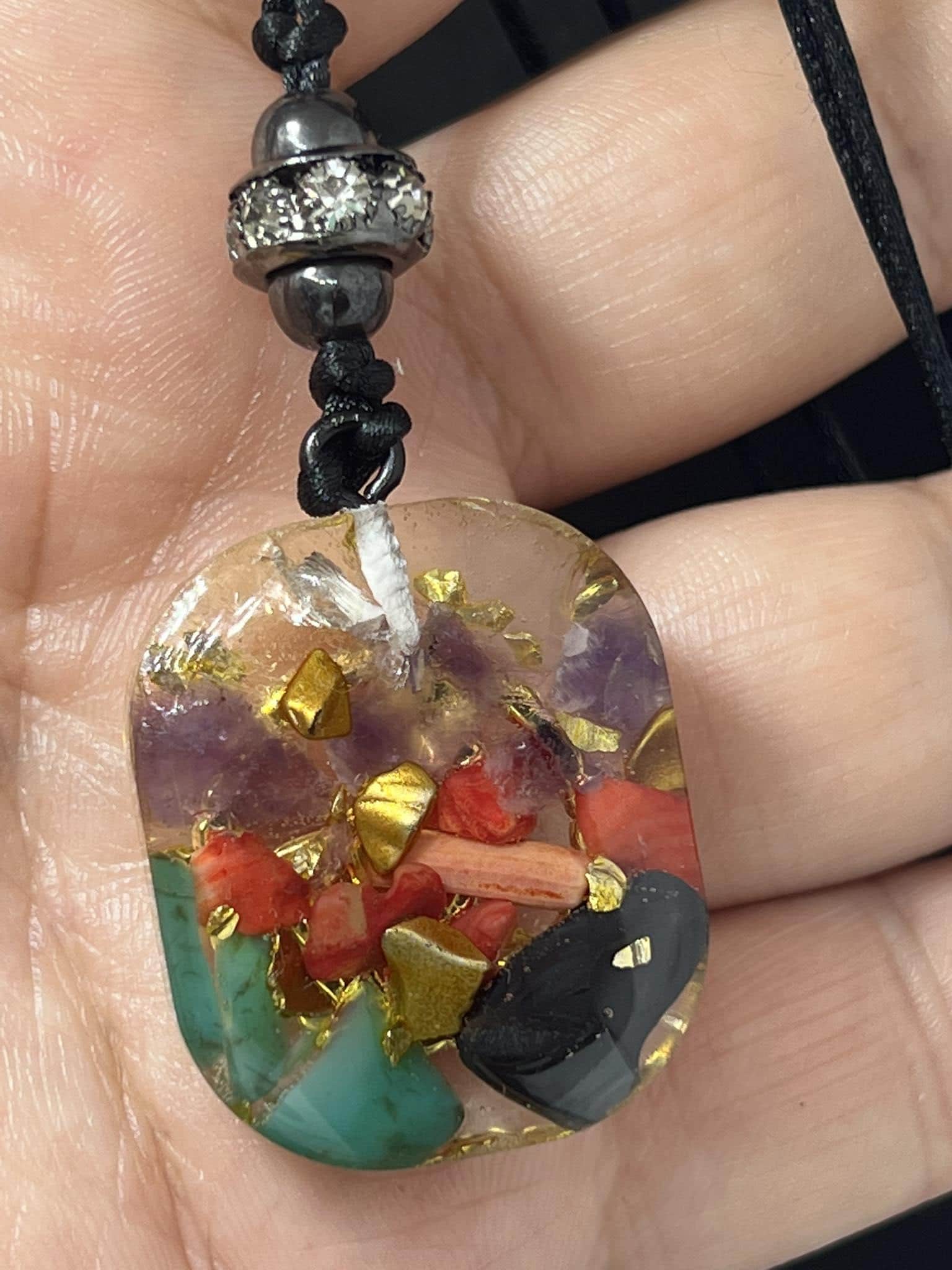 Handmade Resin Y- pendant Necklace, Aries Zodiac 7 chakras natural gemstones, adjustable necklace. close up photo for the back side