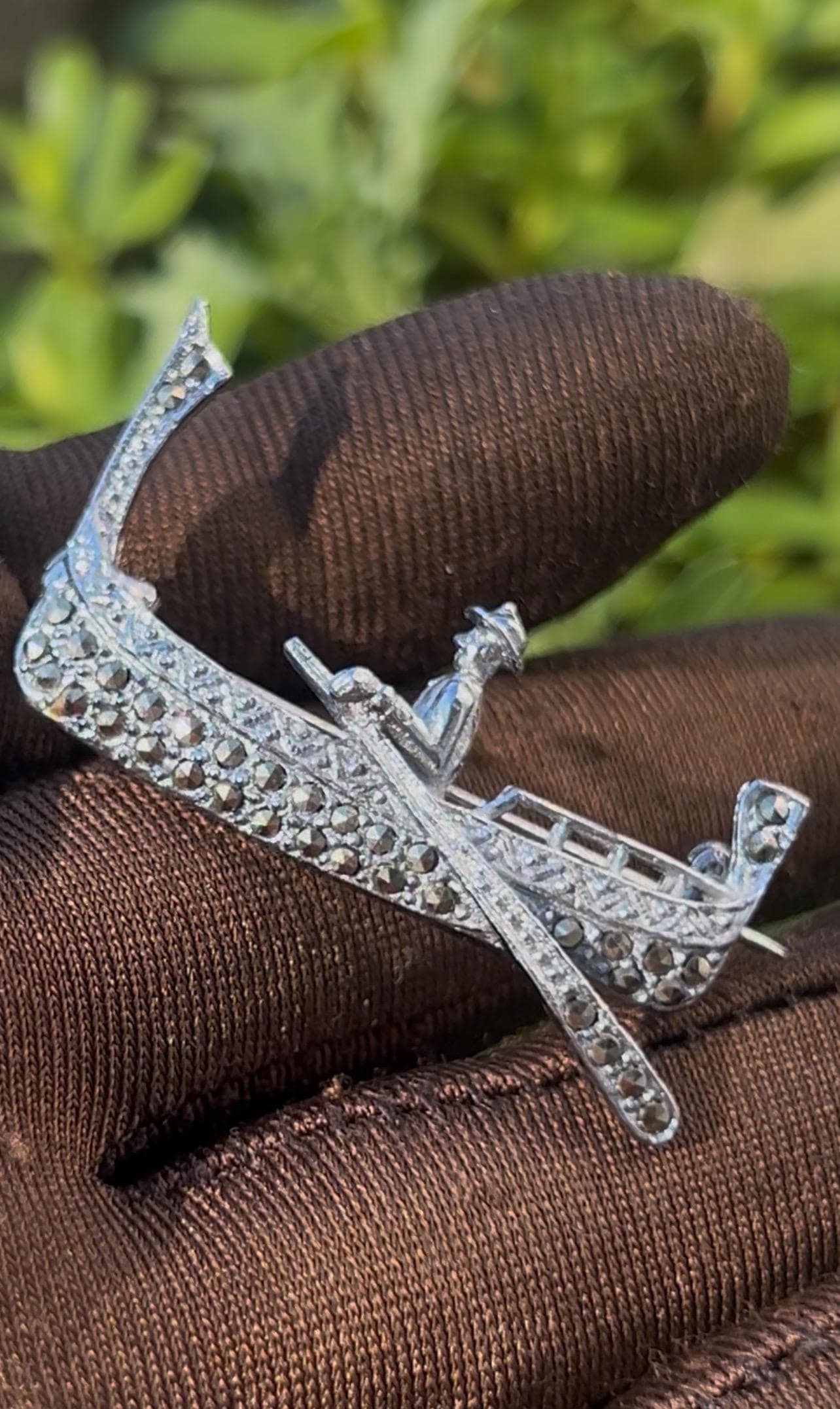 Vintage gondola brooch from the 1990s. Crafted in silver tone metal and adorned with natural marcasite stones