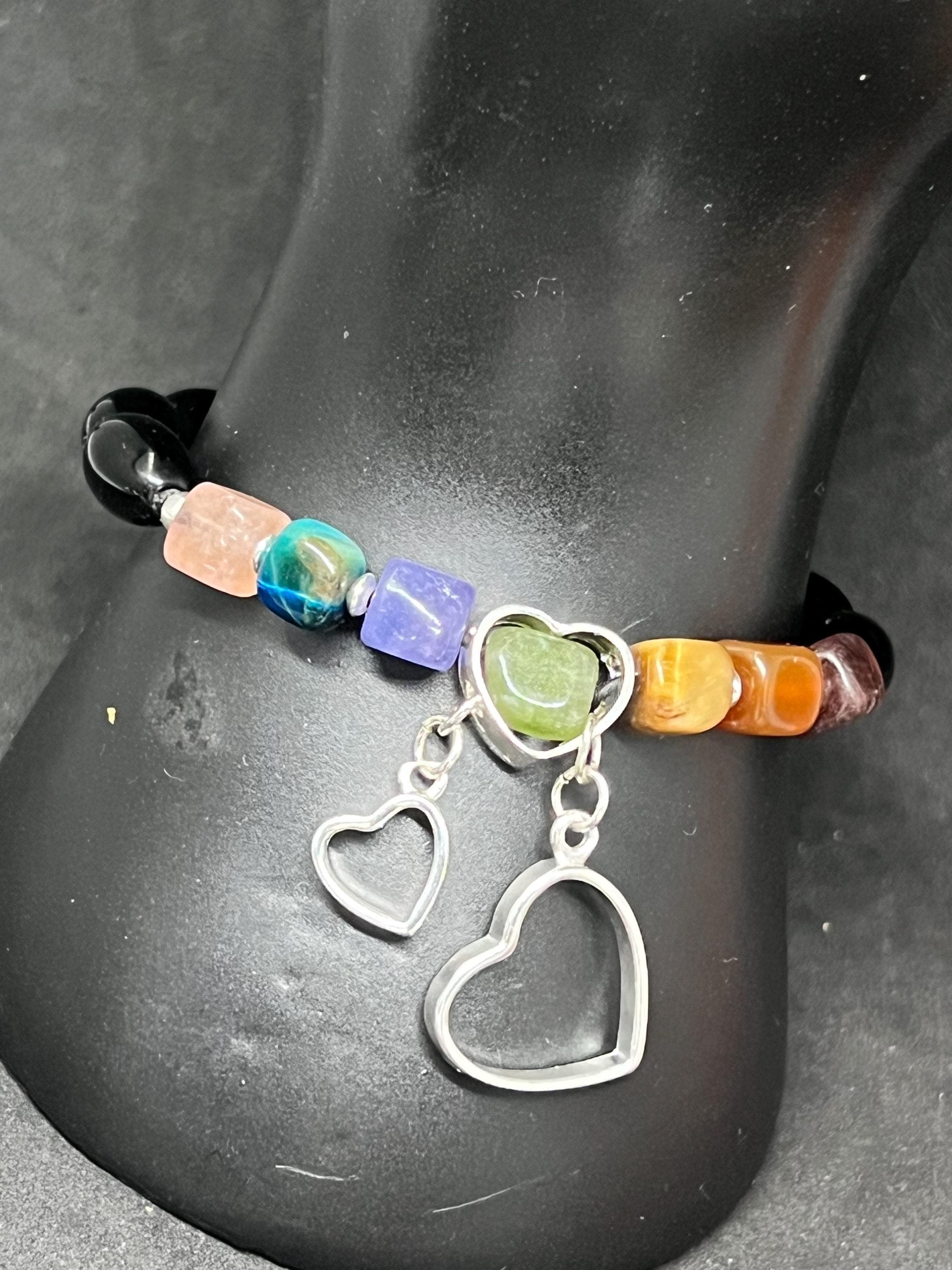 Natural gemstones Bracelet, 7 chacra jewellery, worn on a black manniquin.