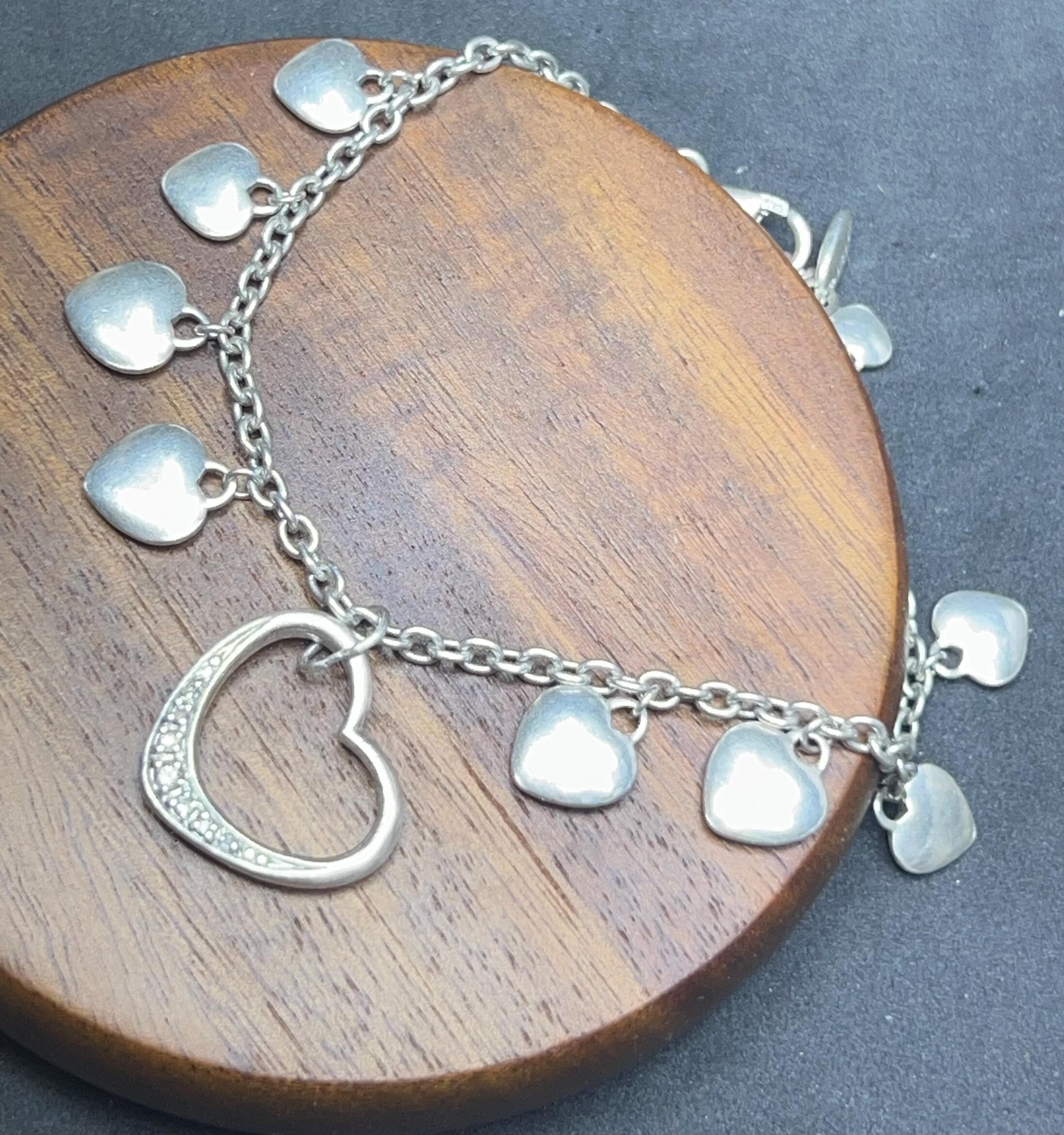 vintage ESPRIT bracelet with solid and openwork heart charms in 925 sterling silver, lobster clasp and oval tag stamped ESPRIT