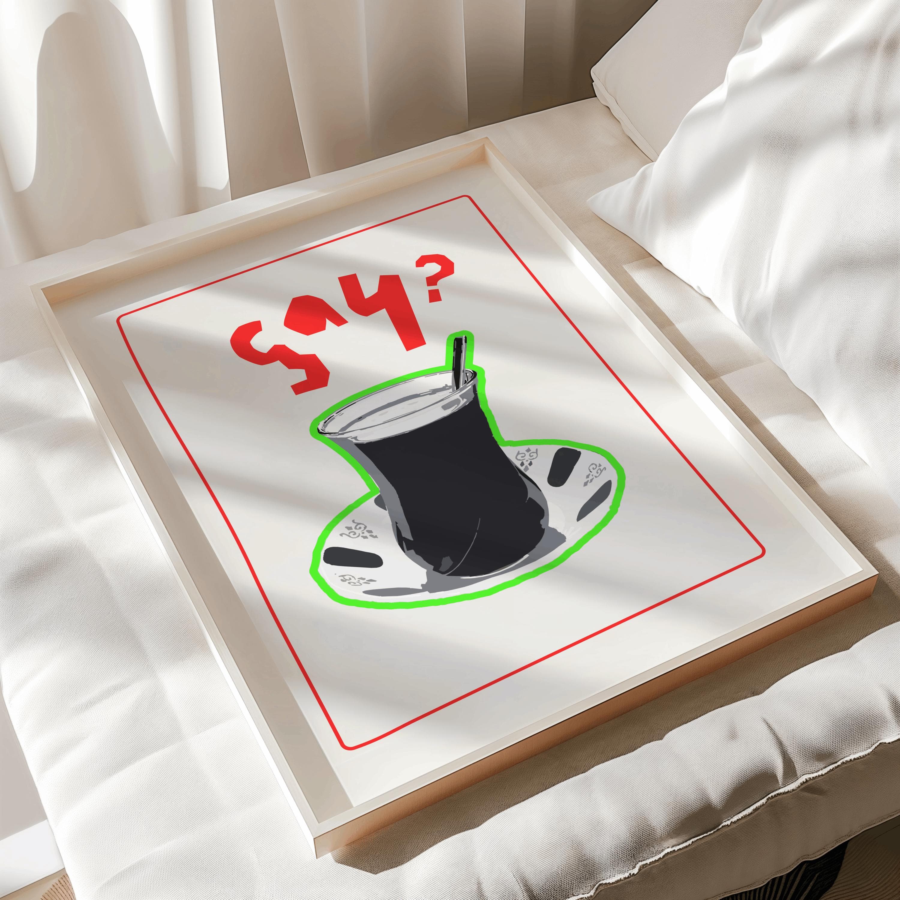 A framed print featuring a stylized illustration of a Turkish tea glass on a saucer, outlined in green. The words "Say?" are written in red. The artwork is set against a white background.