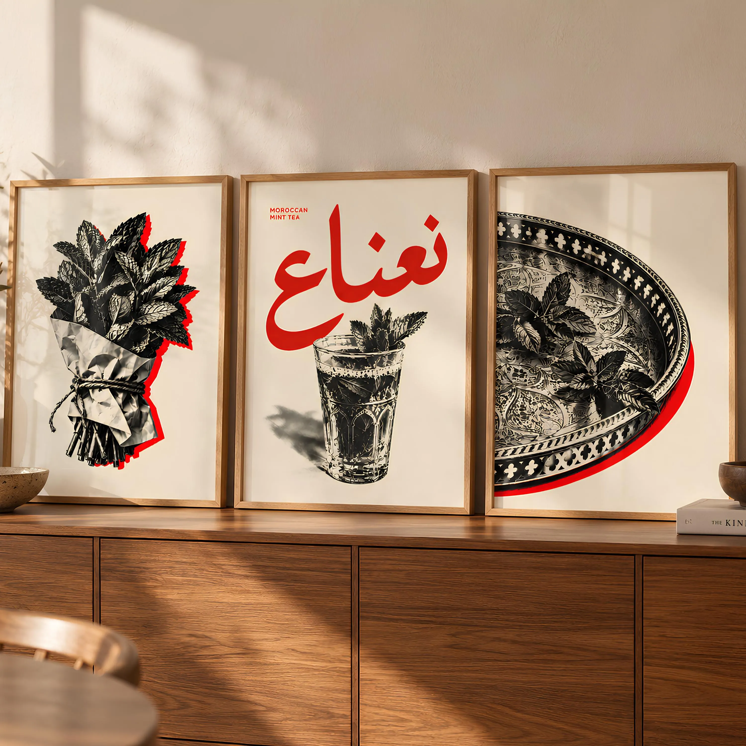 A set of three framed wall art prints featuring black and white illustrations of mint leaves, a glass of tea, and an ornate metal tray. The central print displays the text "MOROCCAN MINT TEA" and large red Arabic calligraphy.