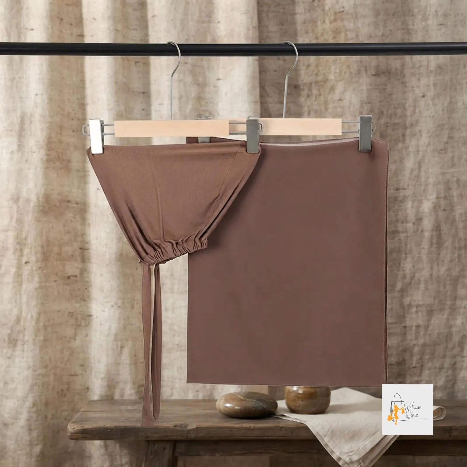 Lightweight women's chiffon scarf styled with coordinating inner cap.