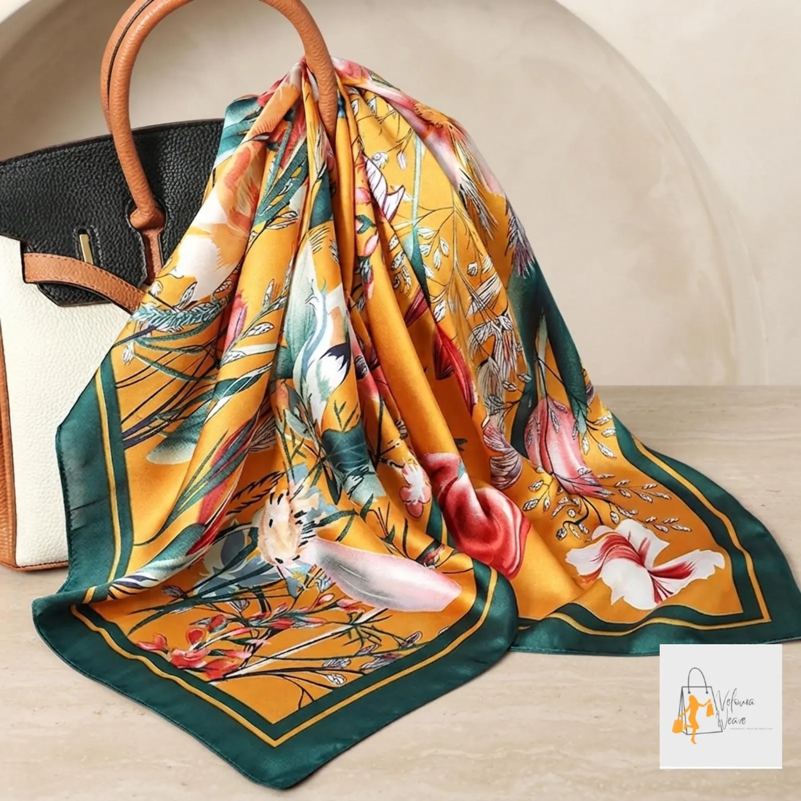Close-up of smooth satin fabric featuring floral vine details.