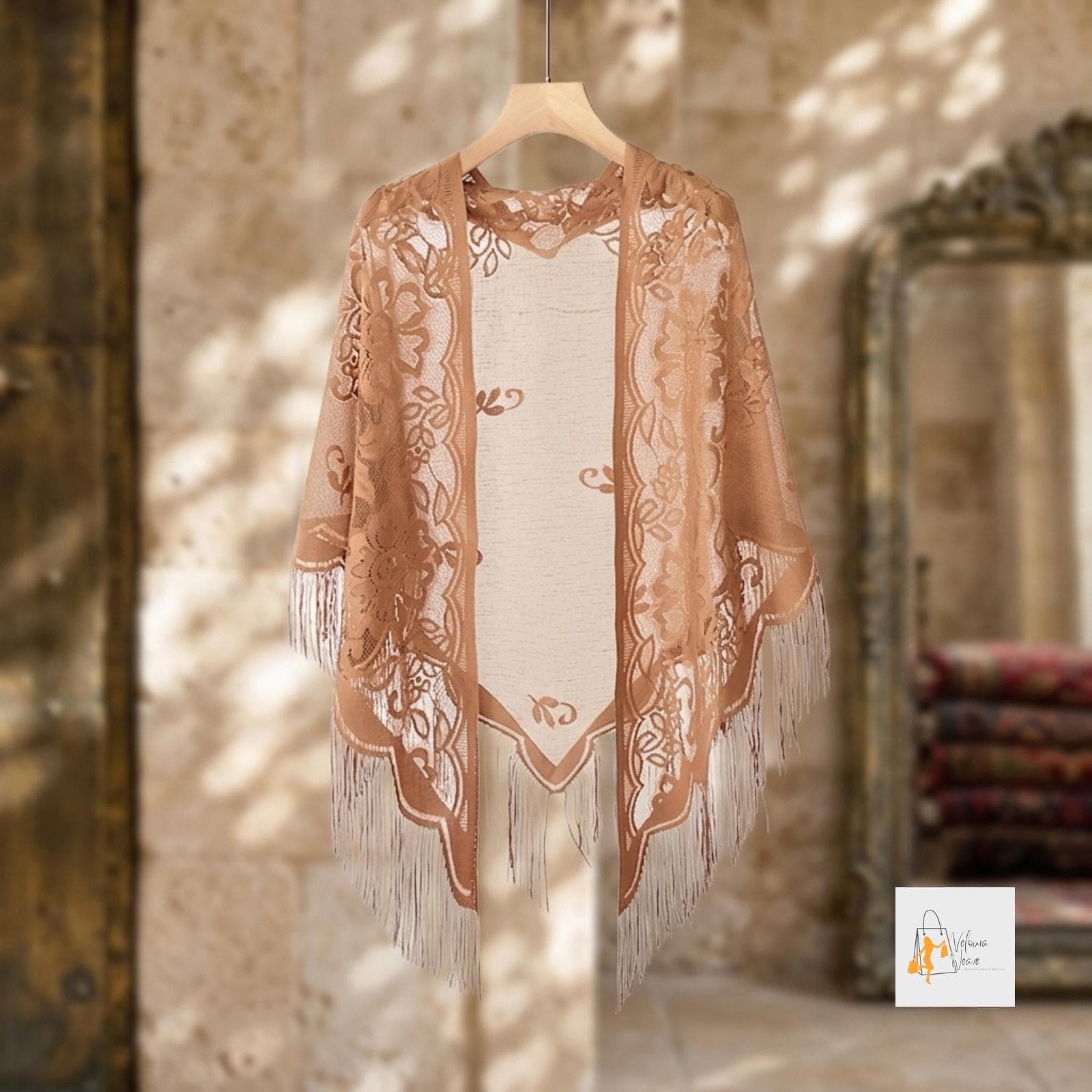 Close-up of delicate lace embroidery on the triangular shawl