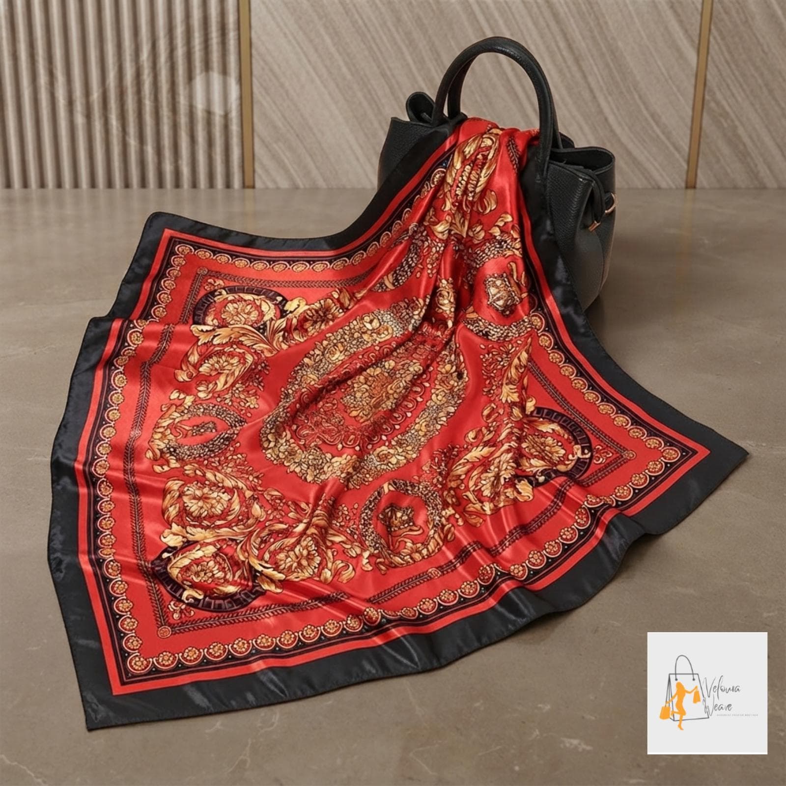 Folded twill satin scarf displaying its detailed decorative print.