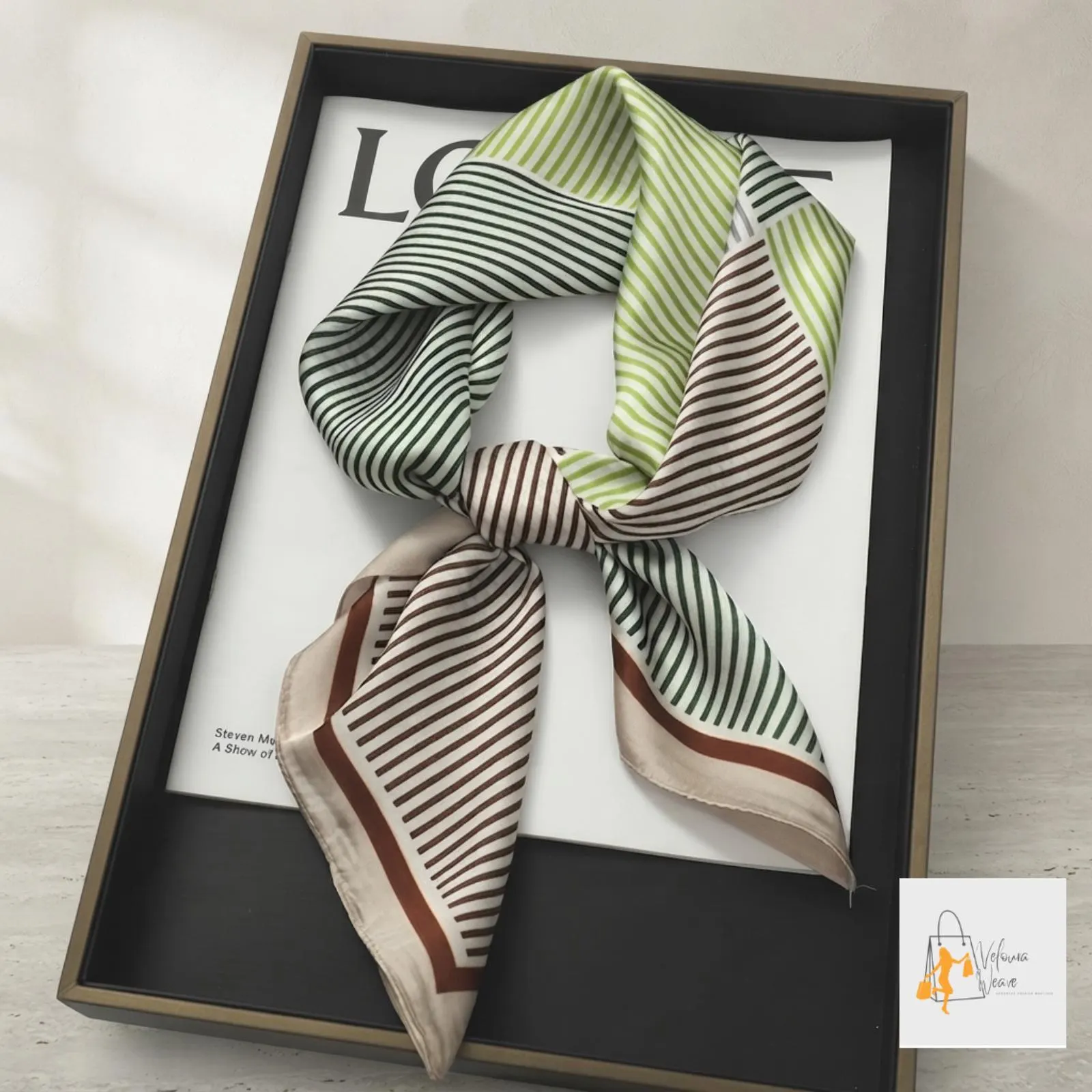 Women's satin scarf paired with an elegant everyday outfit.