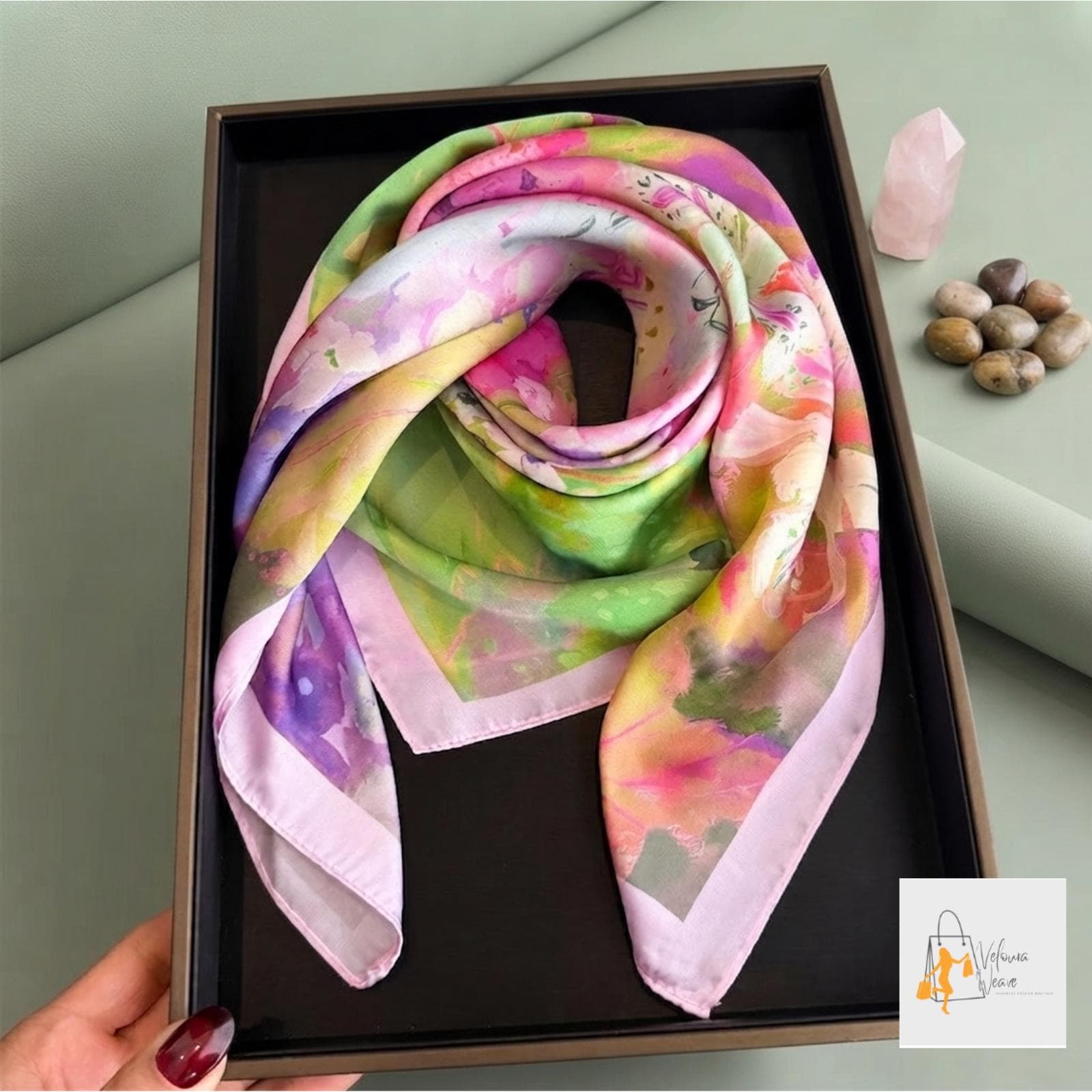 Versatile floral scarf displayed with multiple styling possibilities.