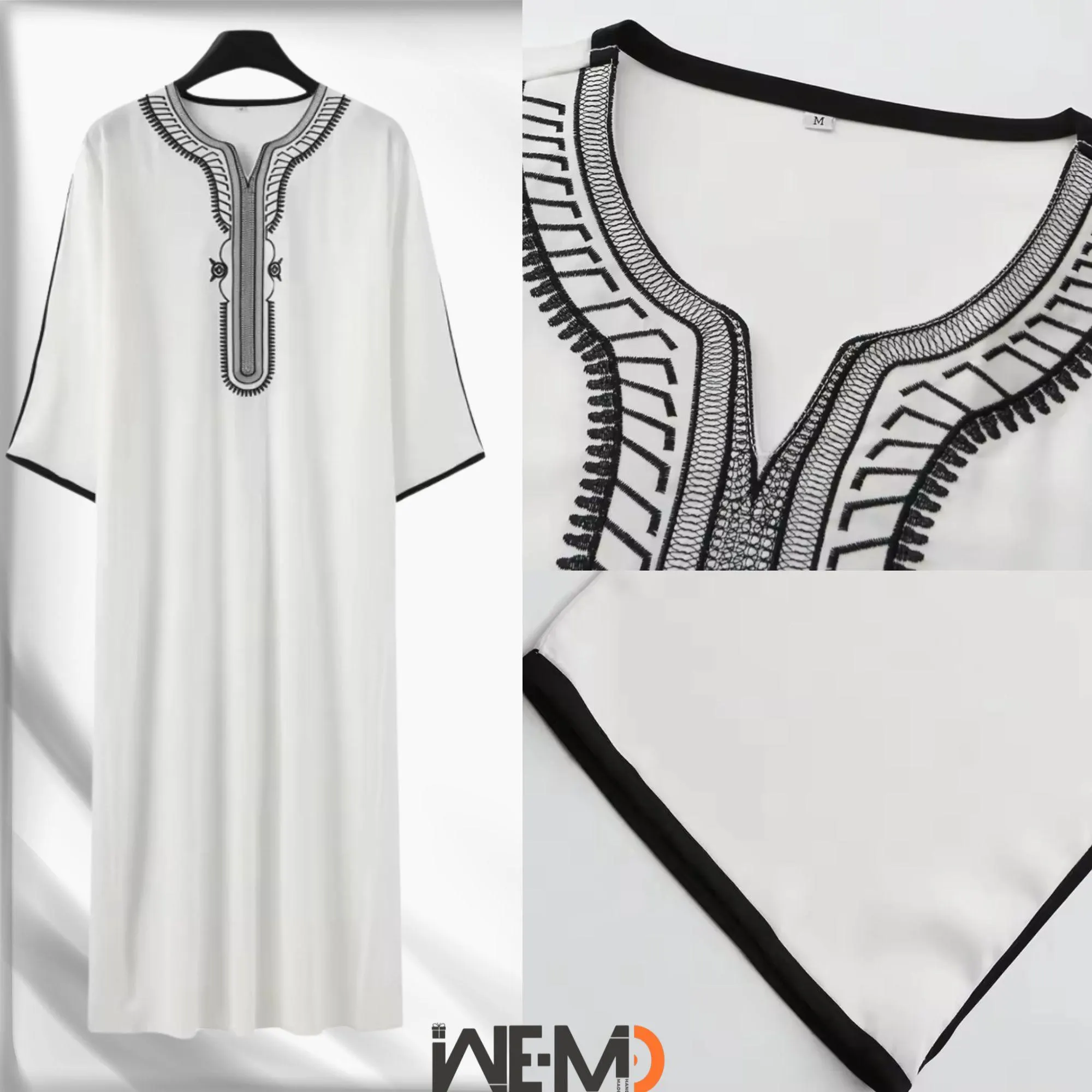 May include: White long-sleeved thobe with black trim and embroidery. The shirt has a V-neck and a size tag that says 'M'.