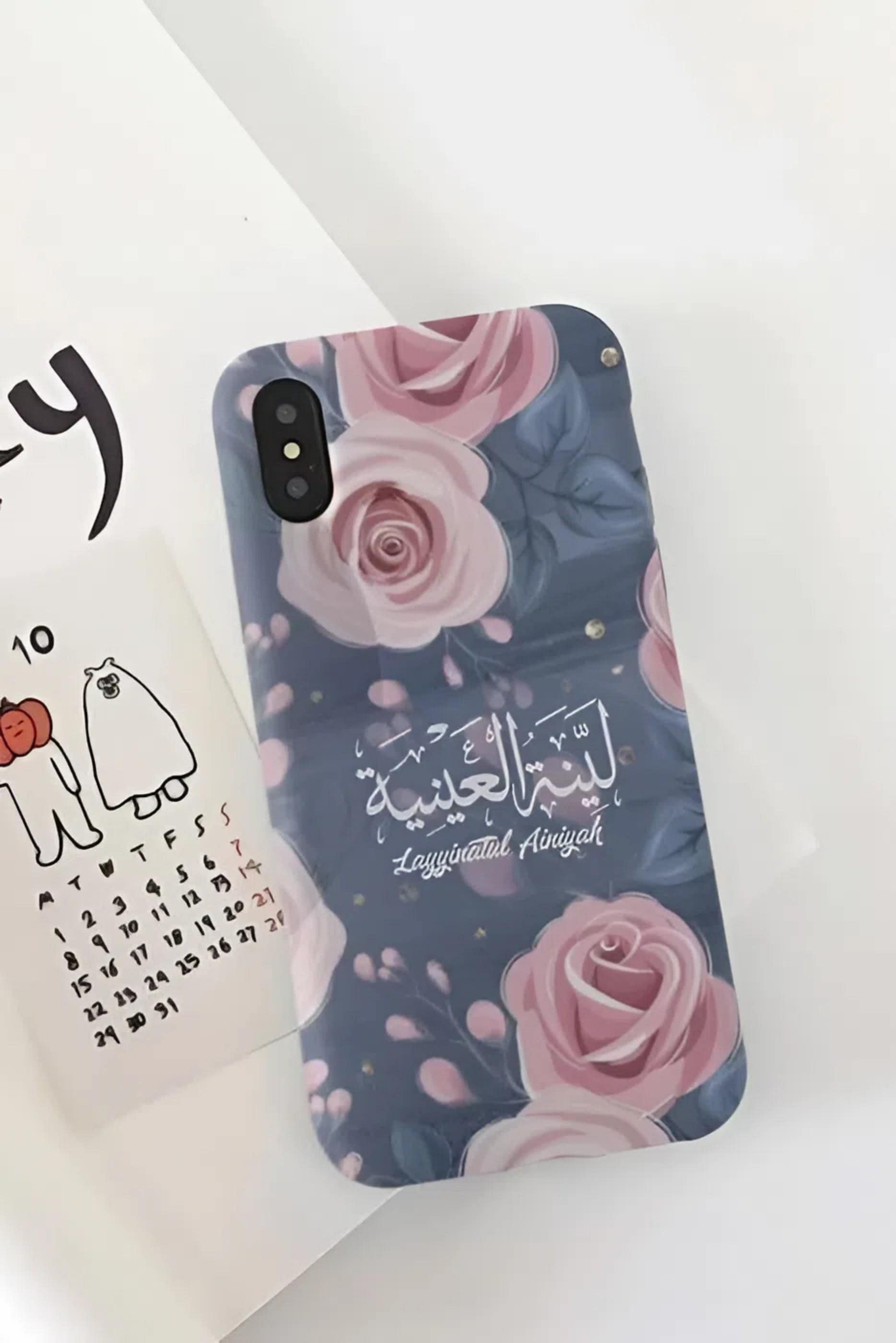 Personalized phone cases featuring detailed Arabic calligraphy, floral patterns, and historical architectural motifs in various finishes like matte black and clear.