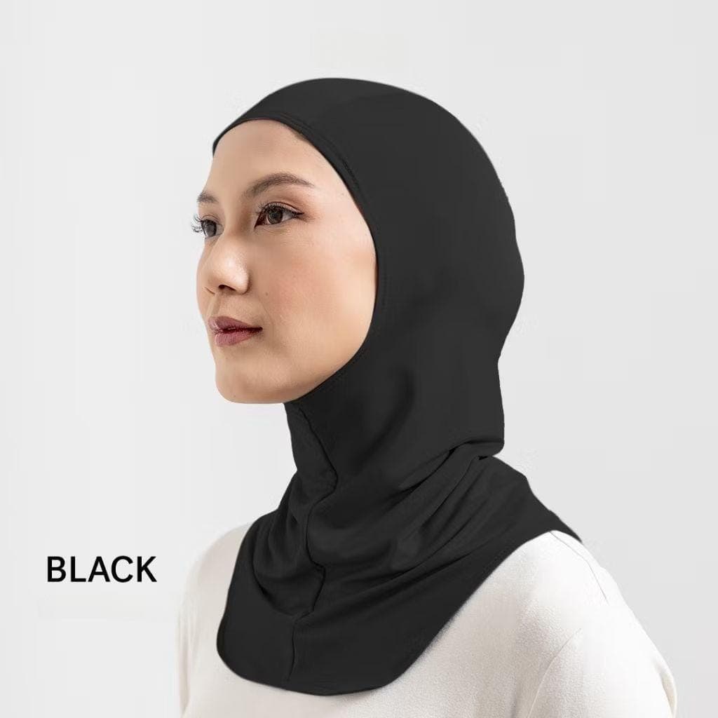 Woman wearing black nylon pull-on sports hijab with quick-dry material and snug athletic fit.