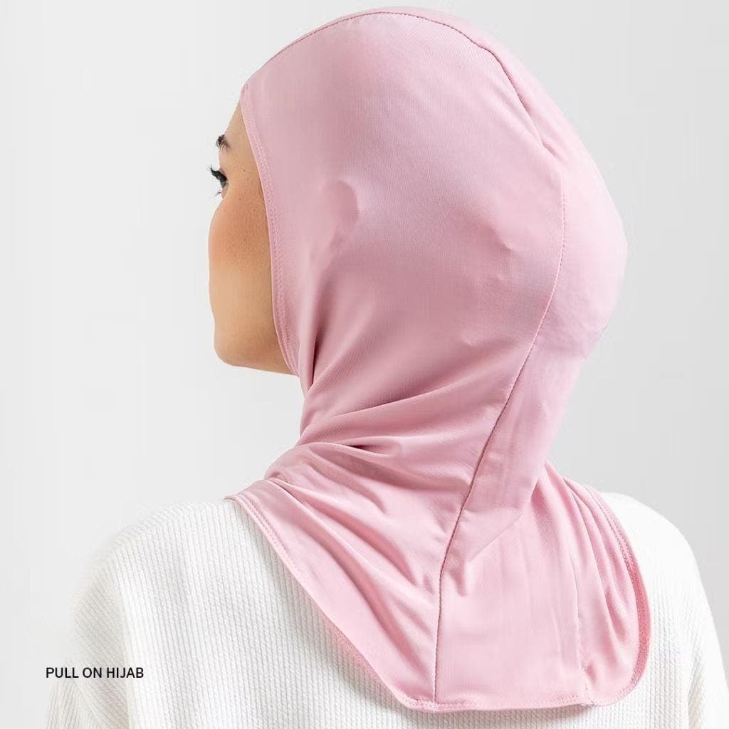 Woman wearing black nylon pull-on sports hijab with quick-dry material and snug athletic fit.