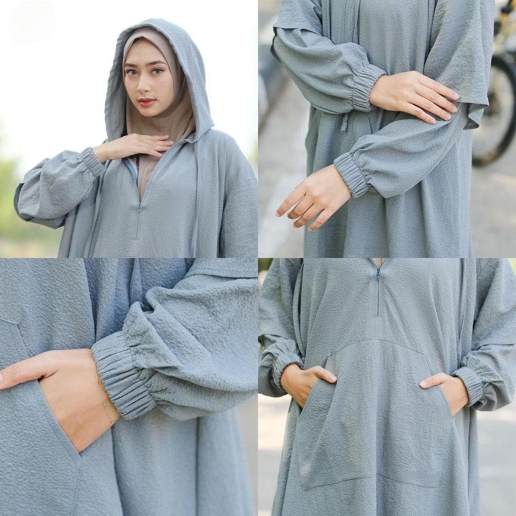 Modest activewear set for Muslim women in gray, featuring loose hoodie tunic and sirwal pants made from bubble stretch fabric, hijab-friendly design