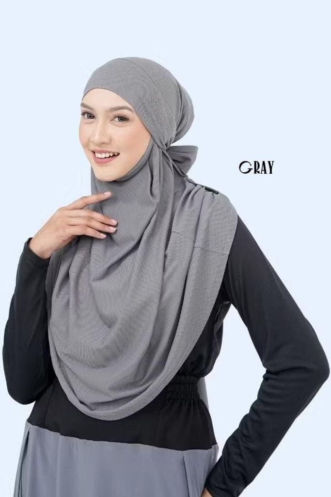 Woman wearing black multifunctional sports khimar hijab made of polyester spandex drifit fabric, quick dry and breathable
