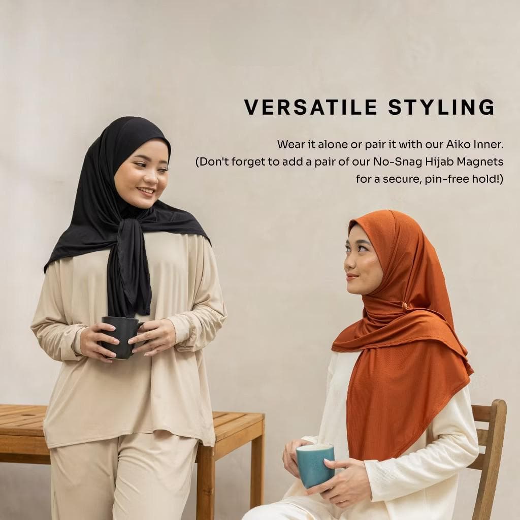 Woman wearing slip-on black sport hijab made of ultralite spandex polyester fabric