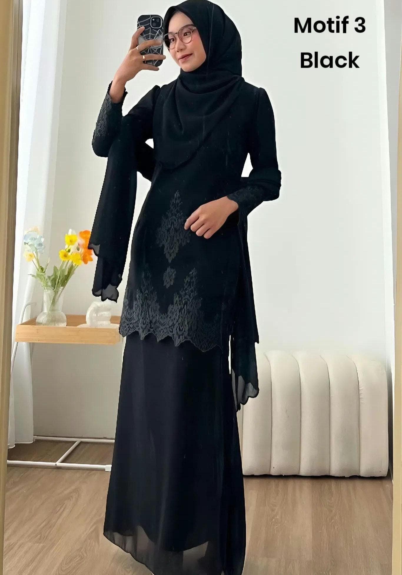 Two women wearing embroidered modest long-sleeve dress sets with matching skirts in navy and black, styled for formal outdoor event.
