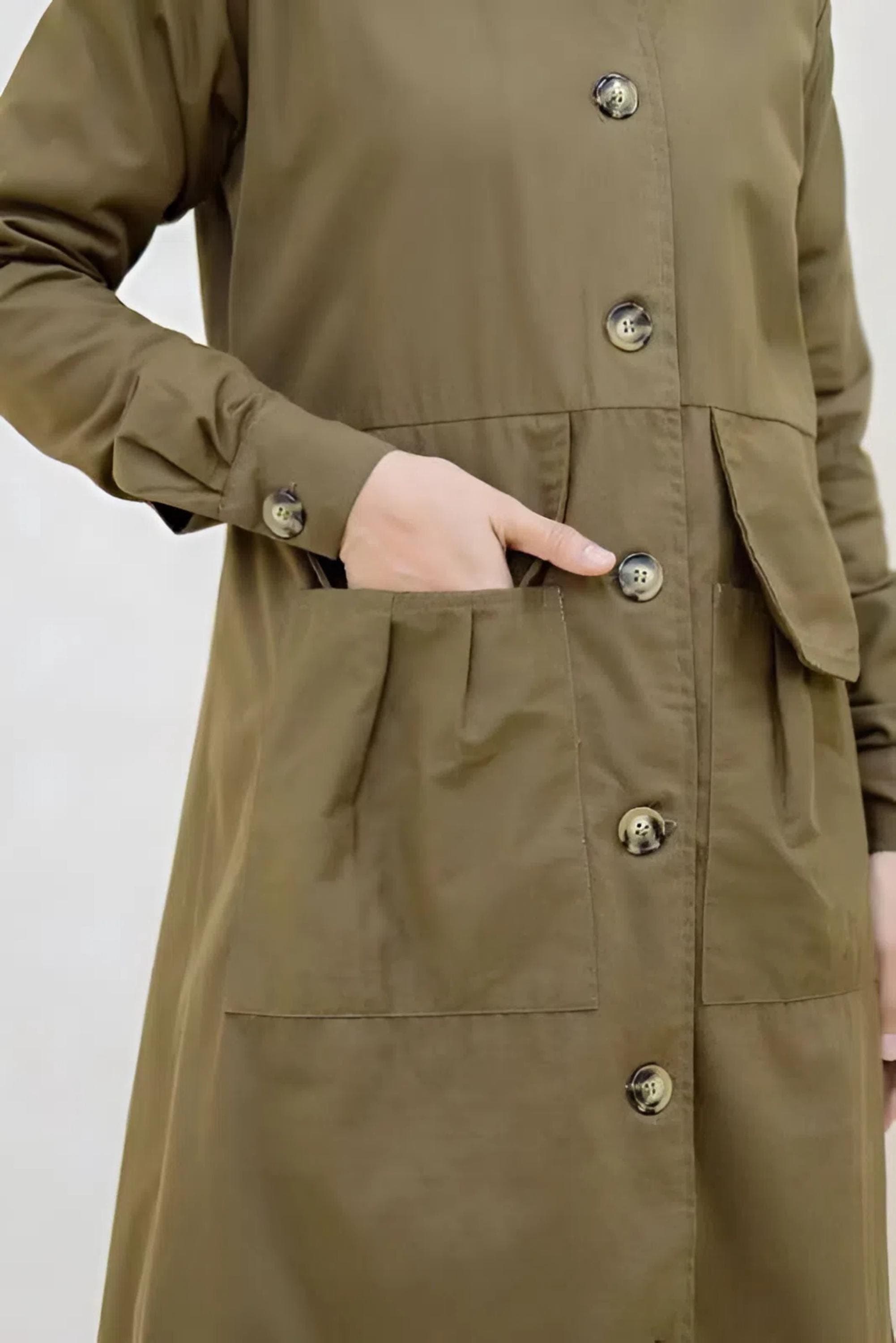 “Full-length olive baby canvas longcoat with buttons and flap pockets for modest wear”