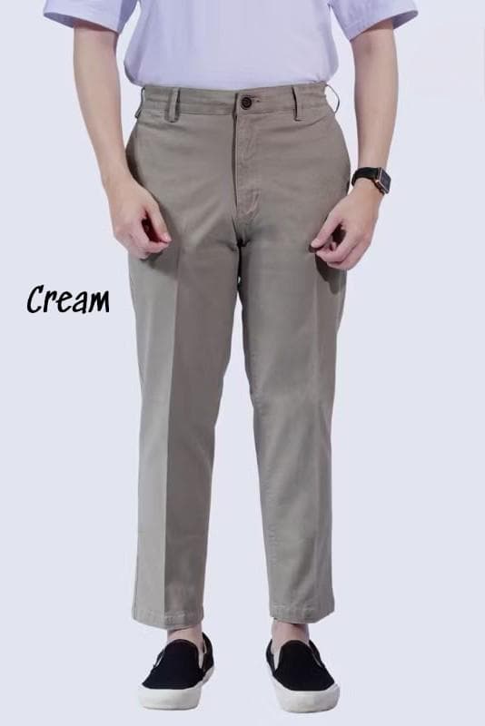 “Men’s cream slim fit chino pants made from cotton material with modern casual cut”