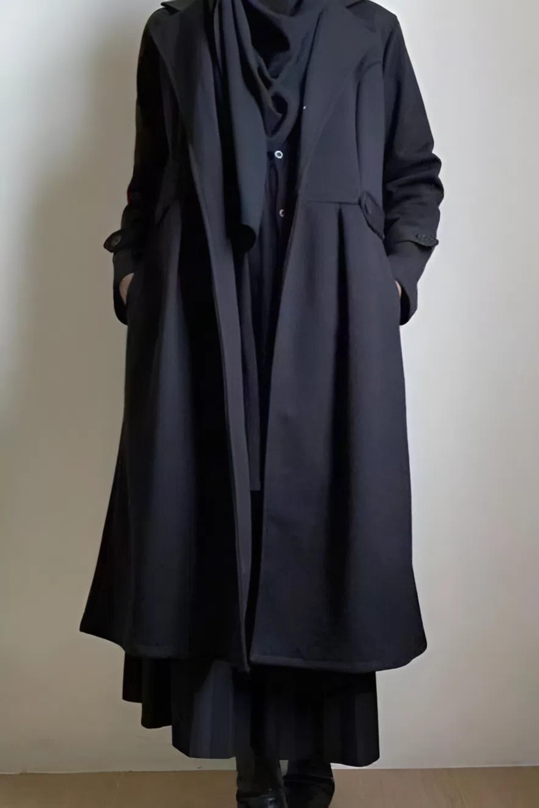 Soft cotton-blend long coat in pink peach color with lapel collar and button closure, made from stretch interlock fabric