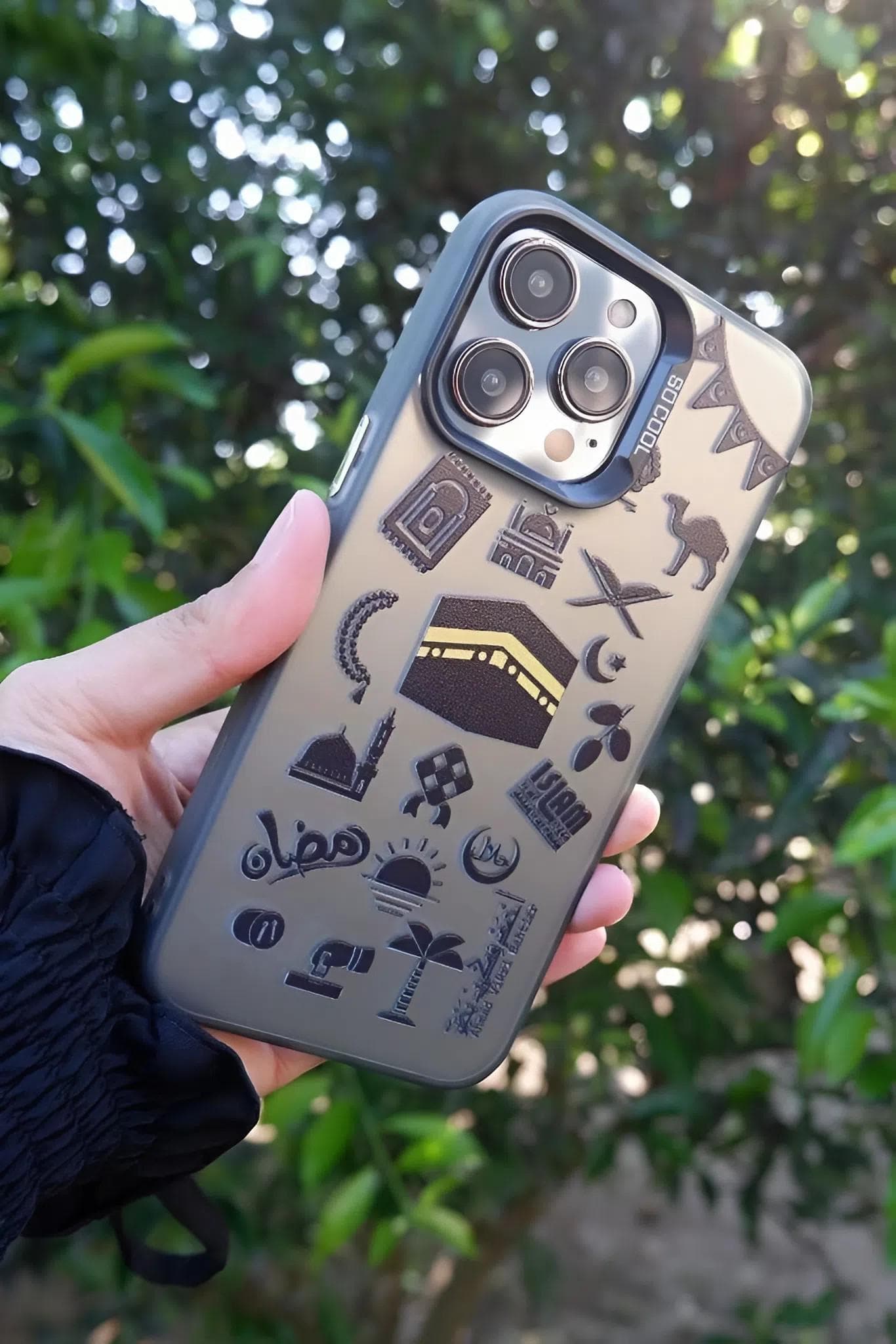 A premium black matte phone case featuring a detailed gold-printed Ottoman Empire emblem with historical weapons and shields.