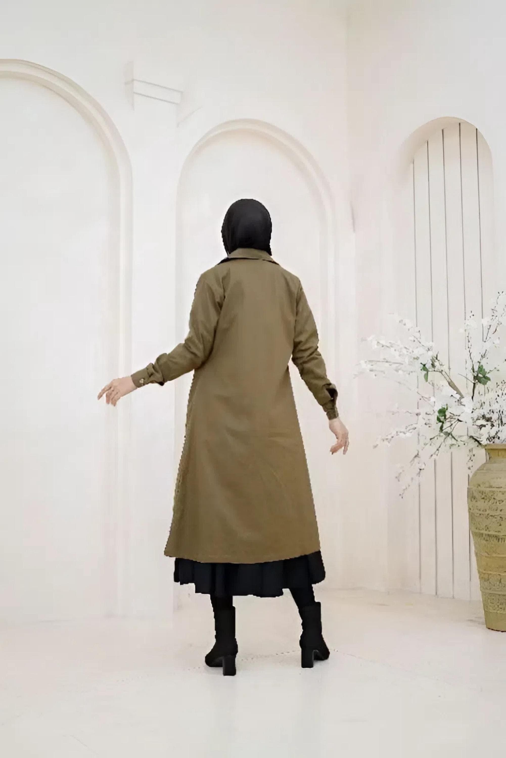 “Full-length olive baby canvas longcoat with buttons and flap pockets for modest wear”