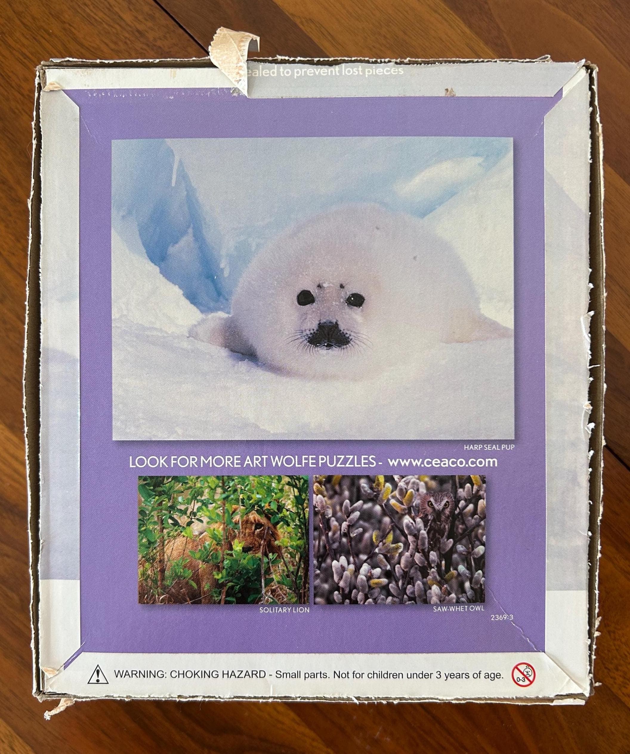 Art Wolfe Vanishing Act Jigsaw Puzzle by Ceaco - 550 Pieces - Seal Image