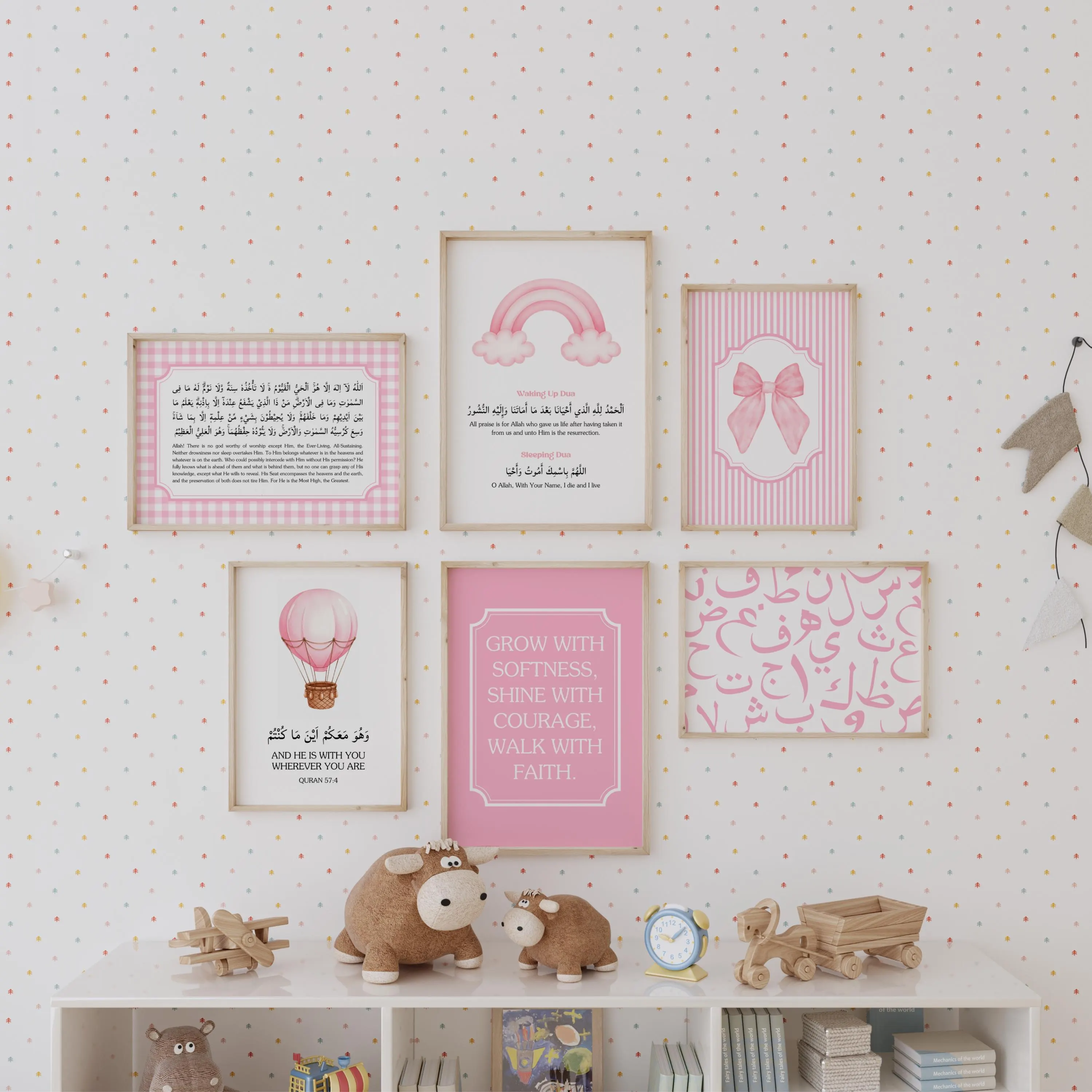 Islamic nursery gallery wall set of six in soft pink and white tones. Featuring: (1) motivational quote for children, (2) a hot air balloon watercolor with the Quranic verse, 'AND HE IS WITH YOU WHEREVER YOU ARE. Quran 57:4' in Arabic and English, (3) stylized pink Arabic alphabet calligraphy, (4) striped print with a pink bow, (5) rainbow and clouds print with Waking Up and Sleeping Du'as in Arabic and English, and (6) Ayatul kursi in Arabic and English with gingham background.