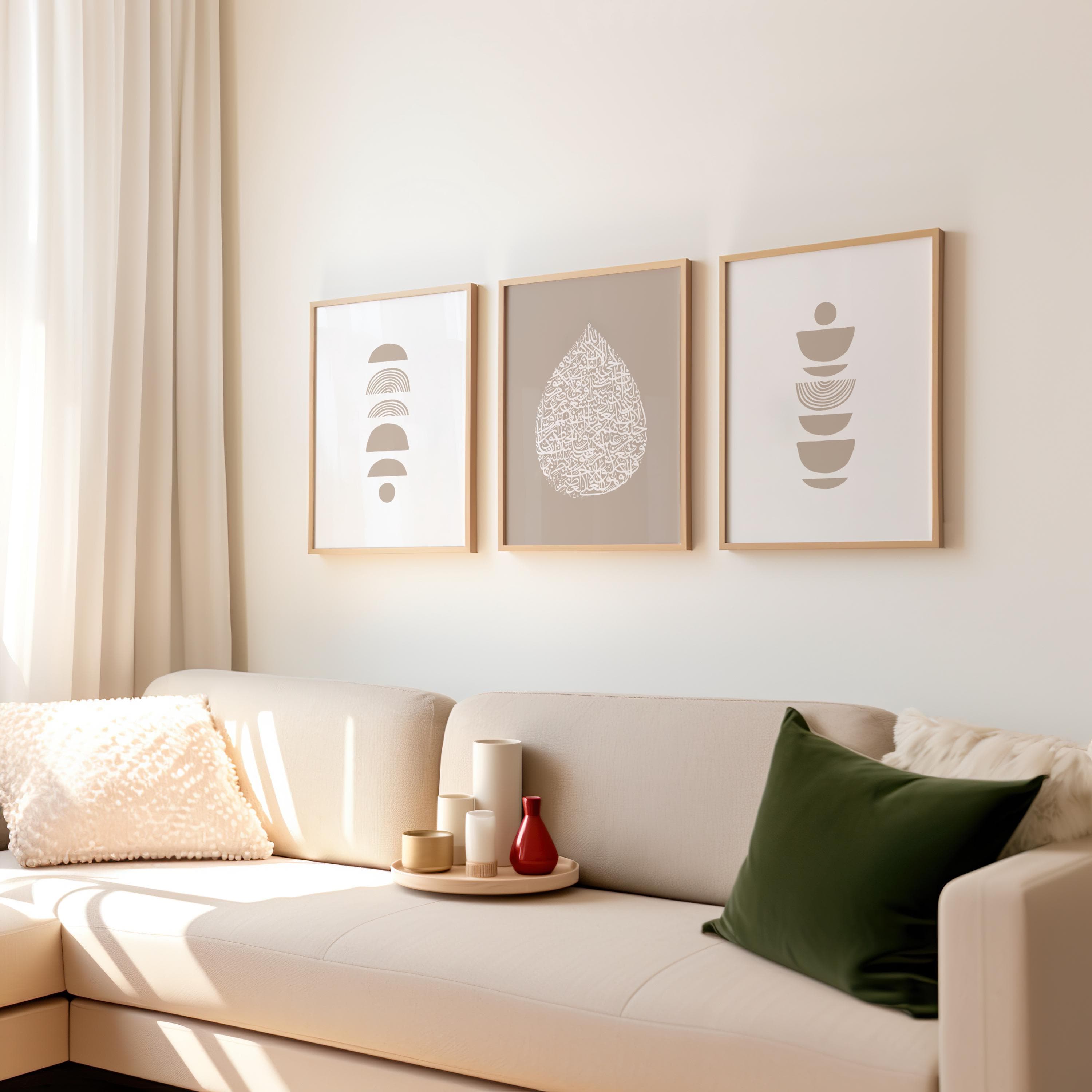 A triptych of framed artworks: left features stacked geometric shapes in soft boho beige tone; center showcases ayatul kursi Arabic calligraphy in a teardrop on a beige color background; right mirrors the left with balanced abstract forms.
