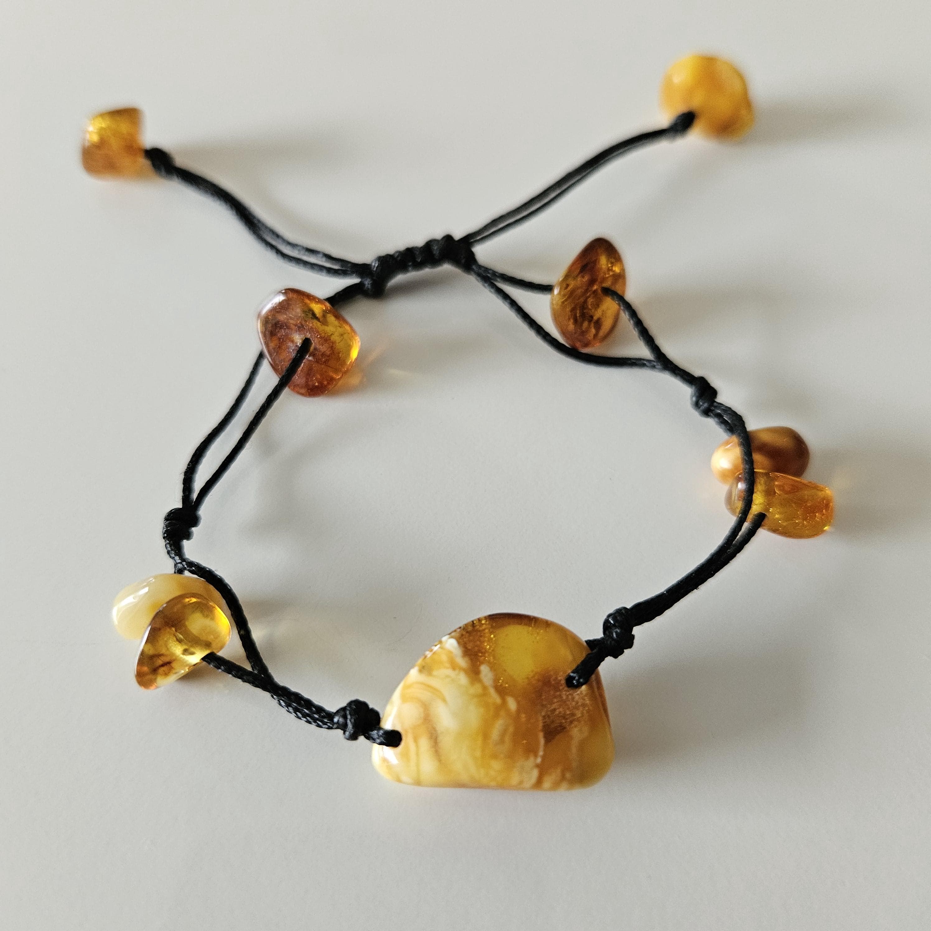 Handmade Baltic Amber Bracelet with Large Centerpiece Stone – An Amulet of Sun and Nature