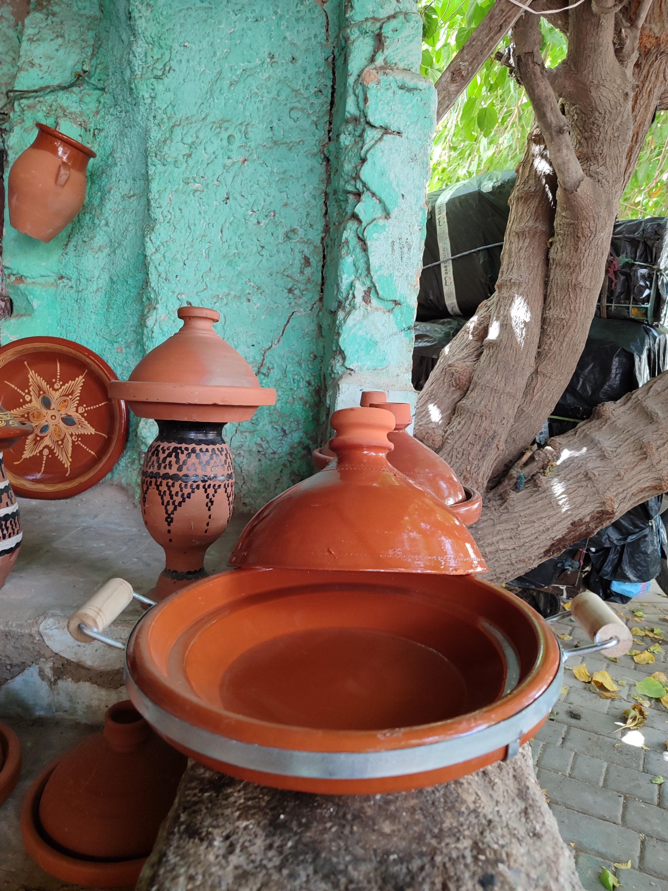 Our large ceramic tagine is the ultimate Moroccan cookware centerpiece for authentic dining experiences. This handmade clay tagine features thick 1/2" walls that retain heat perfectly for slow-cooked Moroccan tajine dishes. The 14" diameter provides ample space for whole chickens or large cuts of meat with vegetables. Made from premium terracotta. The elegant antique tagine design makes it beautiful enough for tableside serving of your tagine for cooking creations.
