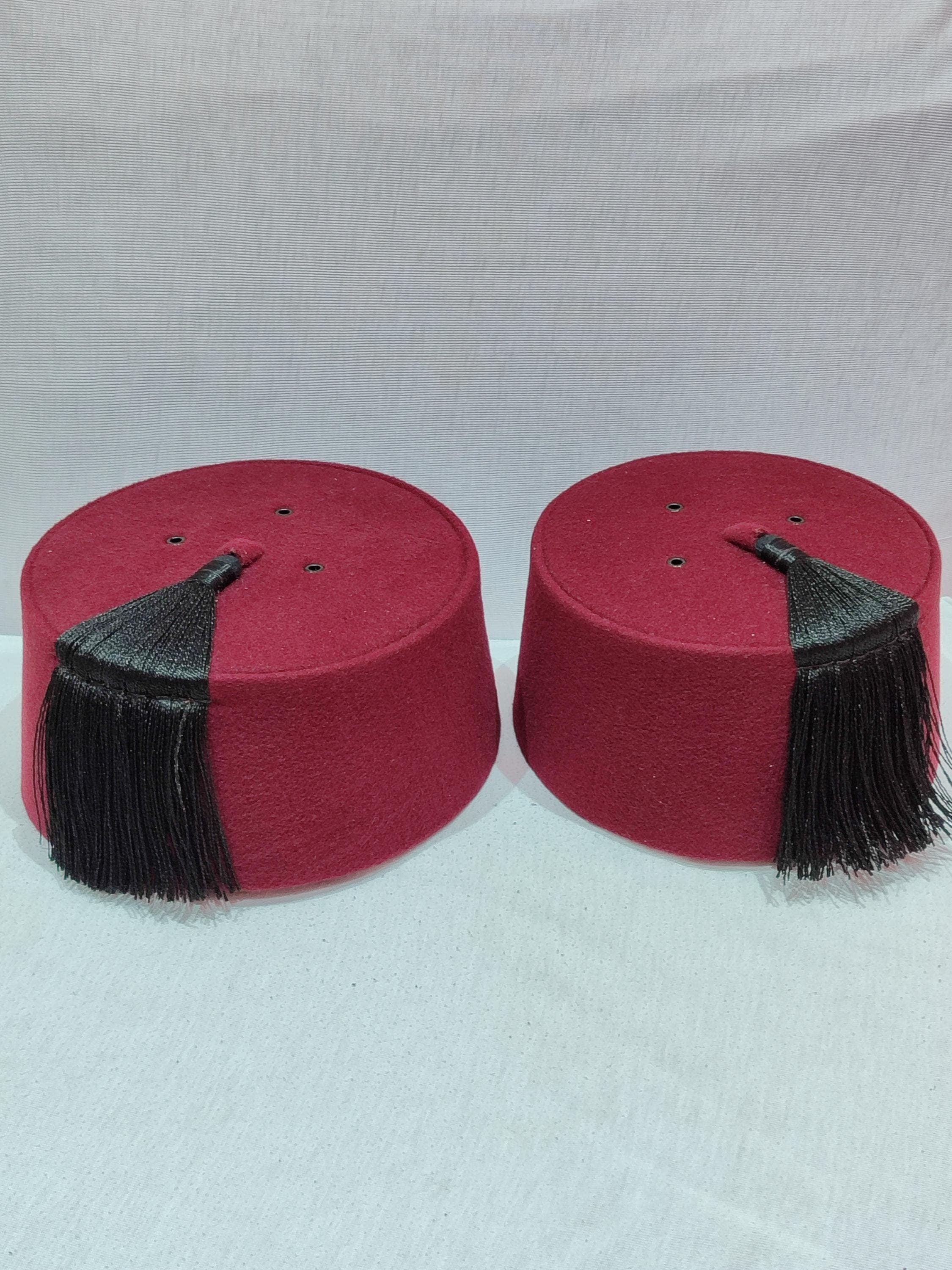 This exquisite Matching Burgundy Fez Set features two handmade Moroccan tarboush hats, perfect for couples seeking coordinated traditional attire. Crafted from premium felt with elegant silk tassels, these red fez hats showcase authentic Moroccan fez craftsmanship. Ideal as a New Year gift for couples, these tarboosh hats add cultural elegance to special occasions, Halloween costumes, or photo shoots.