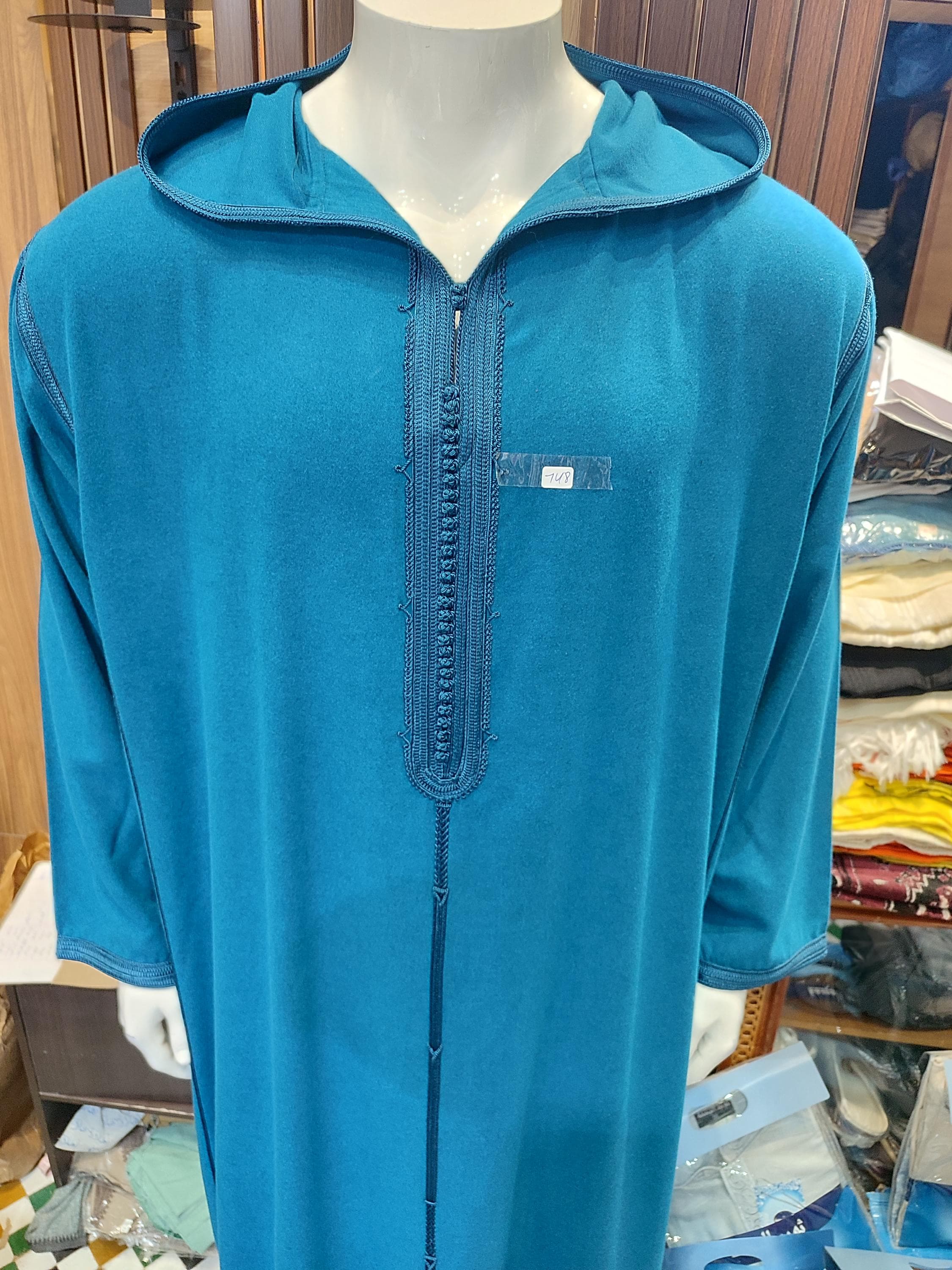 Stay warm and maintain your style with this premium wool jalabiya men design. This hooded thobe is perfect for winter months, offering exceptional warmth without compromising on traditional aesthetics. The wool thobe jubba features reinforced stitching and quality wool fabric that ensures longevity and comfort. Ideal for cold weather prayers, Islamic events, or daily wear in cooler climates. The thoughtful design includes practical features like deep pockets and adjustable hood,