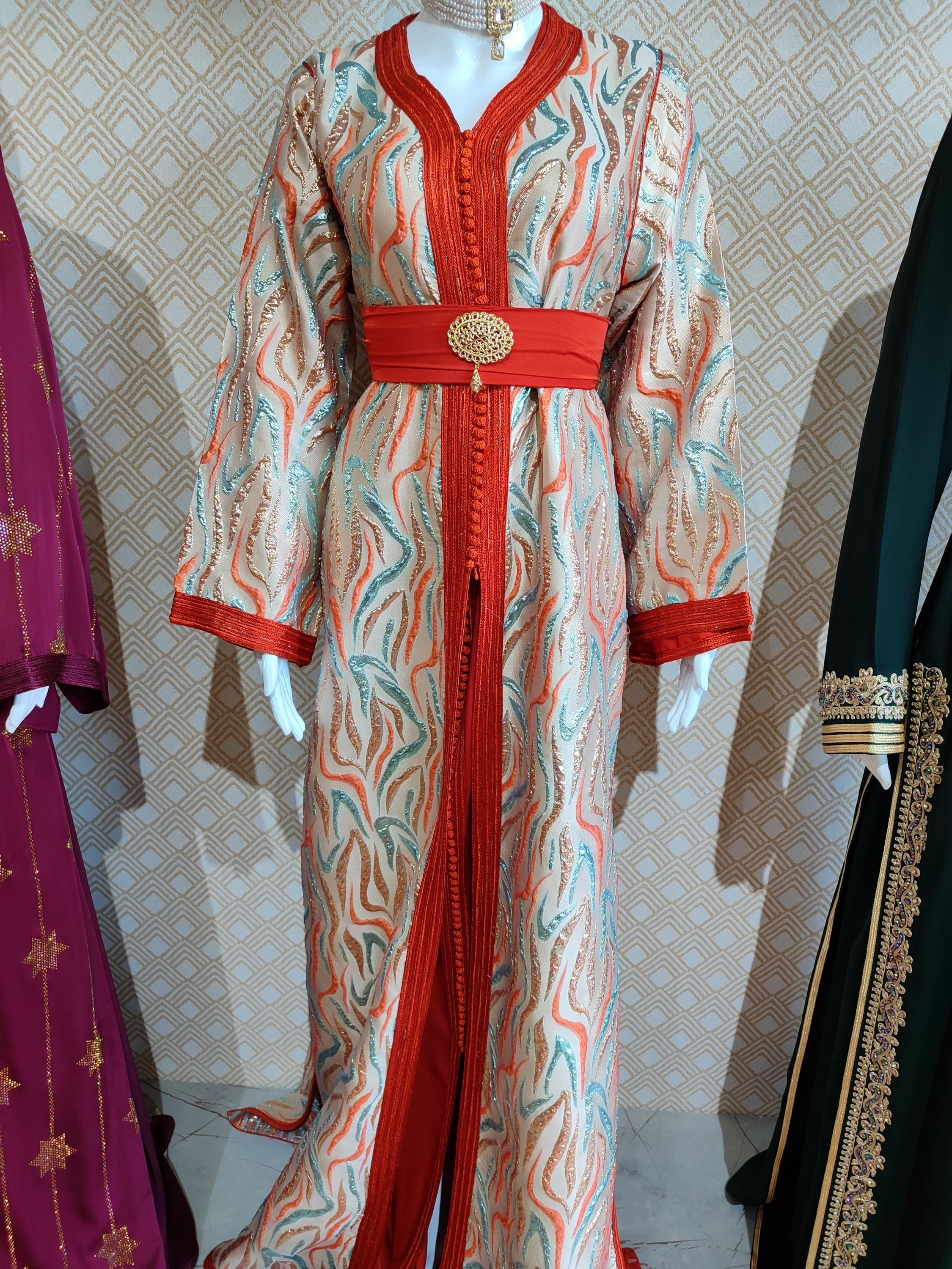 Embrace timeless tradition with our stunning Moroccan takchita, a two-piece set that defines luxury. This Arabic kuftan is a celebration of craftsmanship, featuring detailed embellished patterns and luxurious fabric that drapes beautifully. Ideal for an Islamic wedding, henna night, or any modest evening gala, this dress is a symbol of cultural heritage and sophistication. Each piece is carefully designed to make you feel like royalty, making it the ultimate choice for a bridal thobe