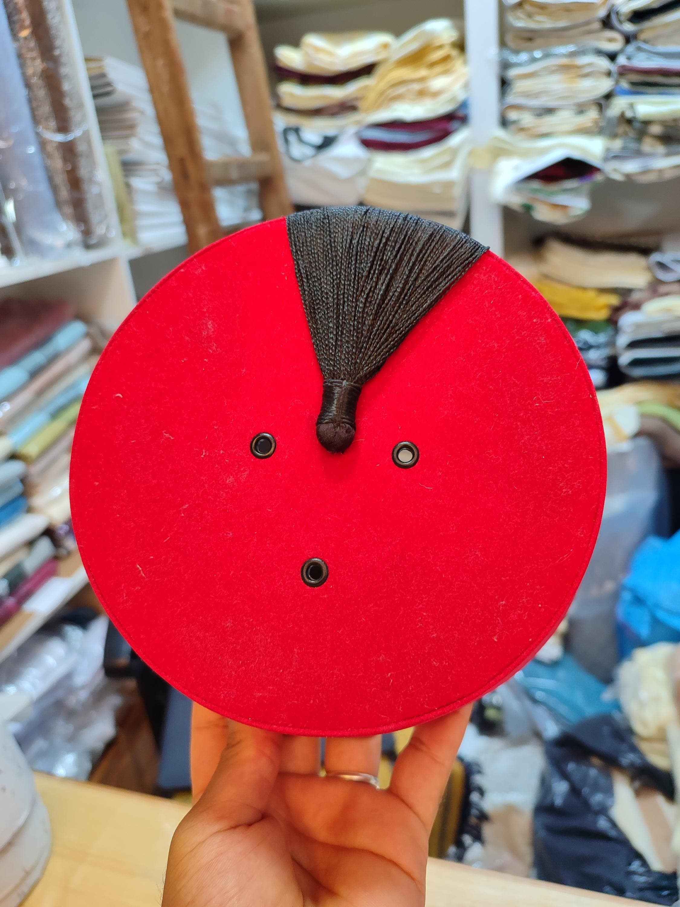 Discover the elegance of this premium Ottoman Hat, a style famously known as the Turkish Fez hat. This tarboosh is meticulously crafted from fine felt, offering a perfect fit and a luxurious look. Its vibrant red hue and elegant tassel make it a standout piece, whether worn as an Islamic hat or a sophisticated fashion item. This doctor who hat inspired accessory is not just a costume piece but a symbol of history and artistry, perfect for collectors and enthusiasts of unique headwear.