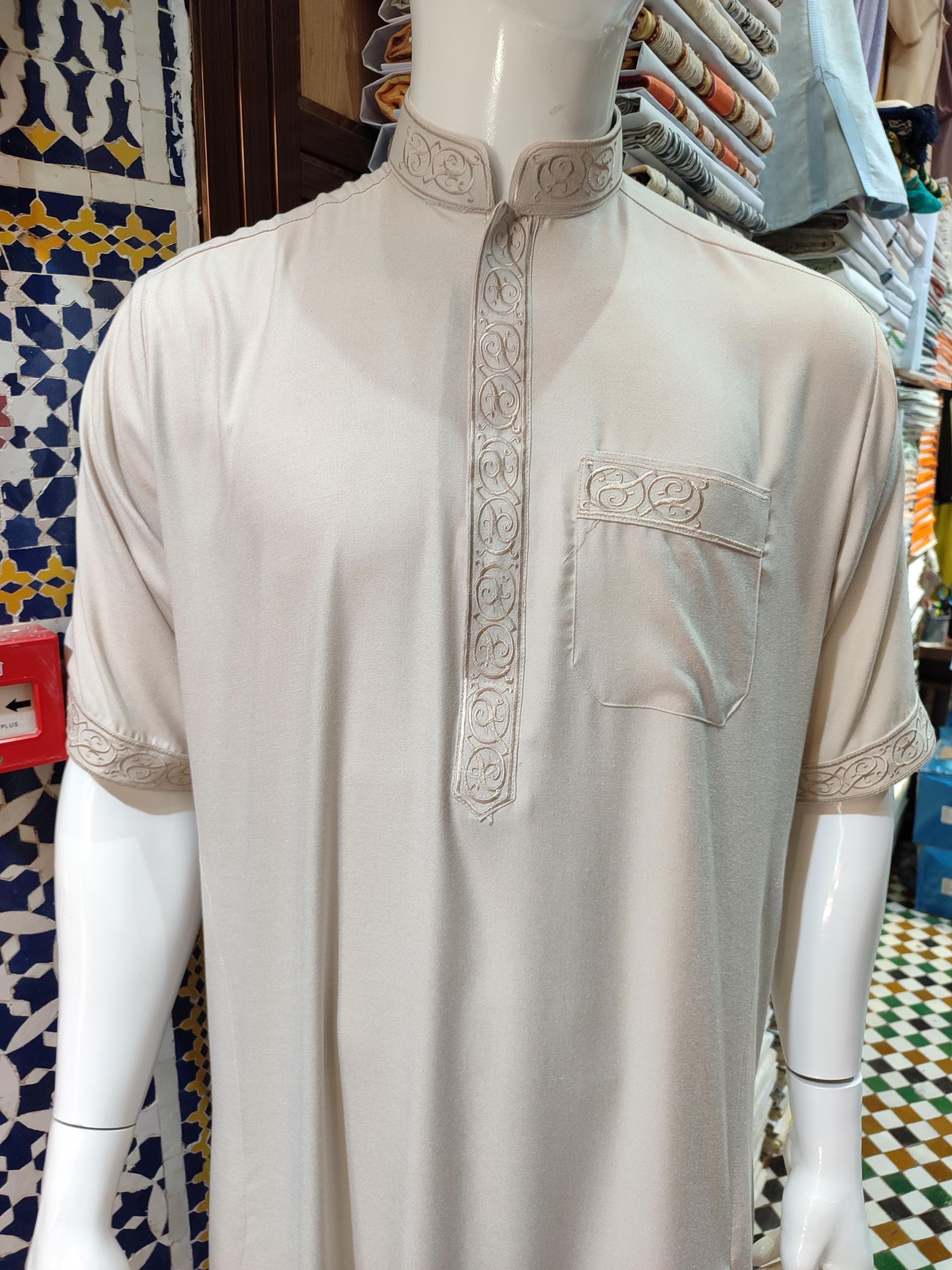 Our wool jalabiya men's thobe is crafted for both comfort and devotion. This Moroccan menswear essential features high-quality wool construction with traditional detailing, making it perfect for Islamic prayer dress needs. The timeless design works equally well as Muslim wedding dress or for daily religious observance. The natural wool fibers provide warmth in winter while remaining breathable. This djellaba men's garment comes with a matching belt and features the classic Moroccan thobe