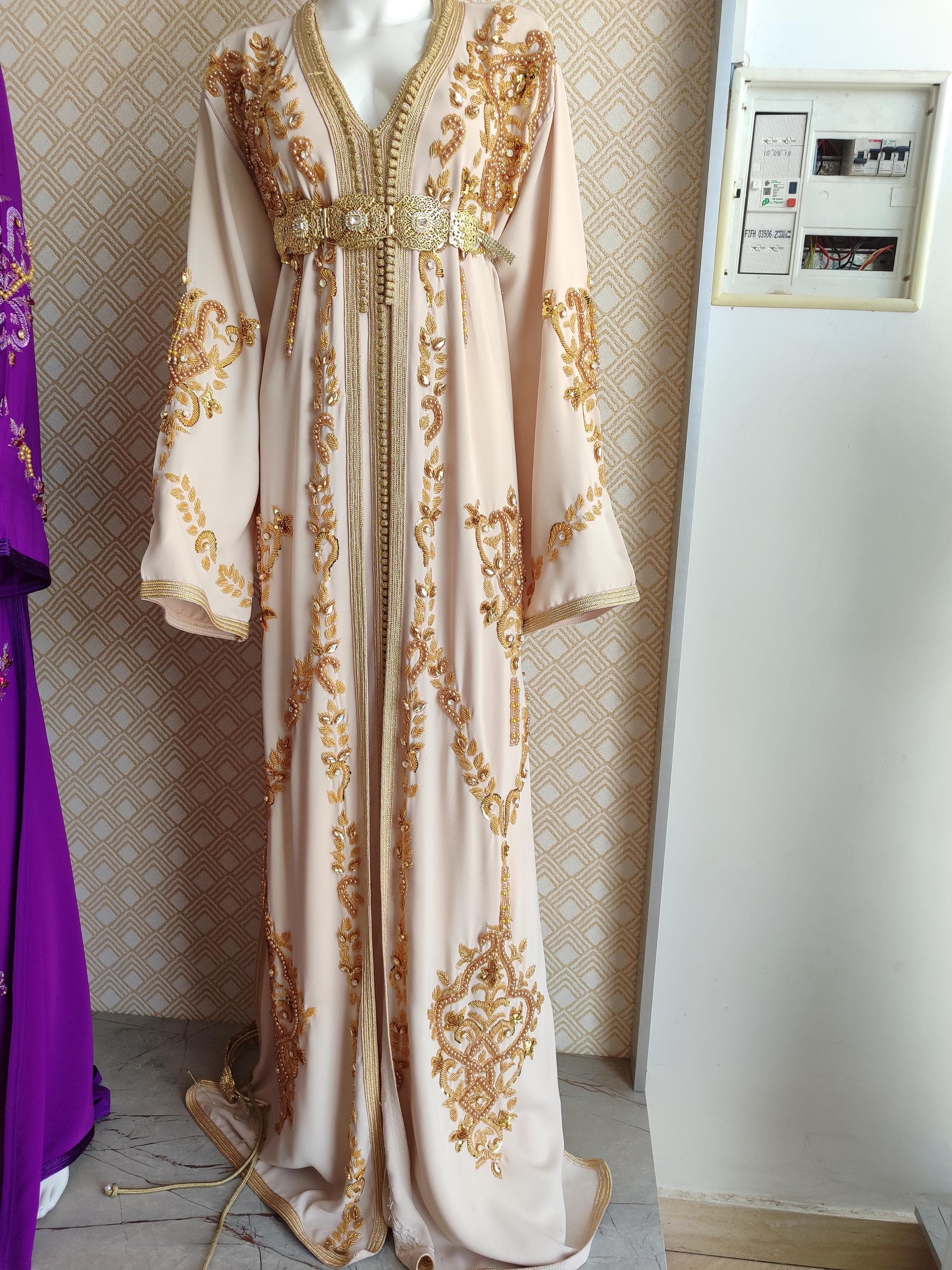 Our Palestinian thobe offers authentic cultural elegance for muslim brides. This arabic islamic dress showcases exquisite tatreez embroidery in a timeless thawb women cut. The lightweight fabric and modest neckline make it ideal for wedding ceremonies and henna parties alike. As both a palestinian dress and modest evening gown, it beautifully bridges heritage and modern bridal fashion. The intricate hand-stitched patterns tell a story, making this more than just a muslim wedding dress