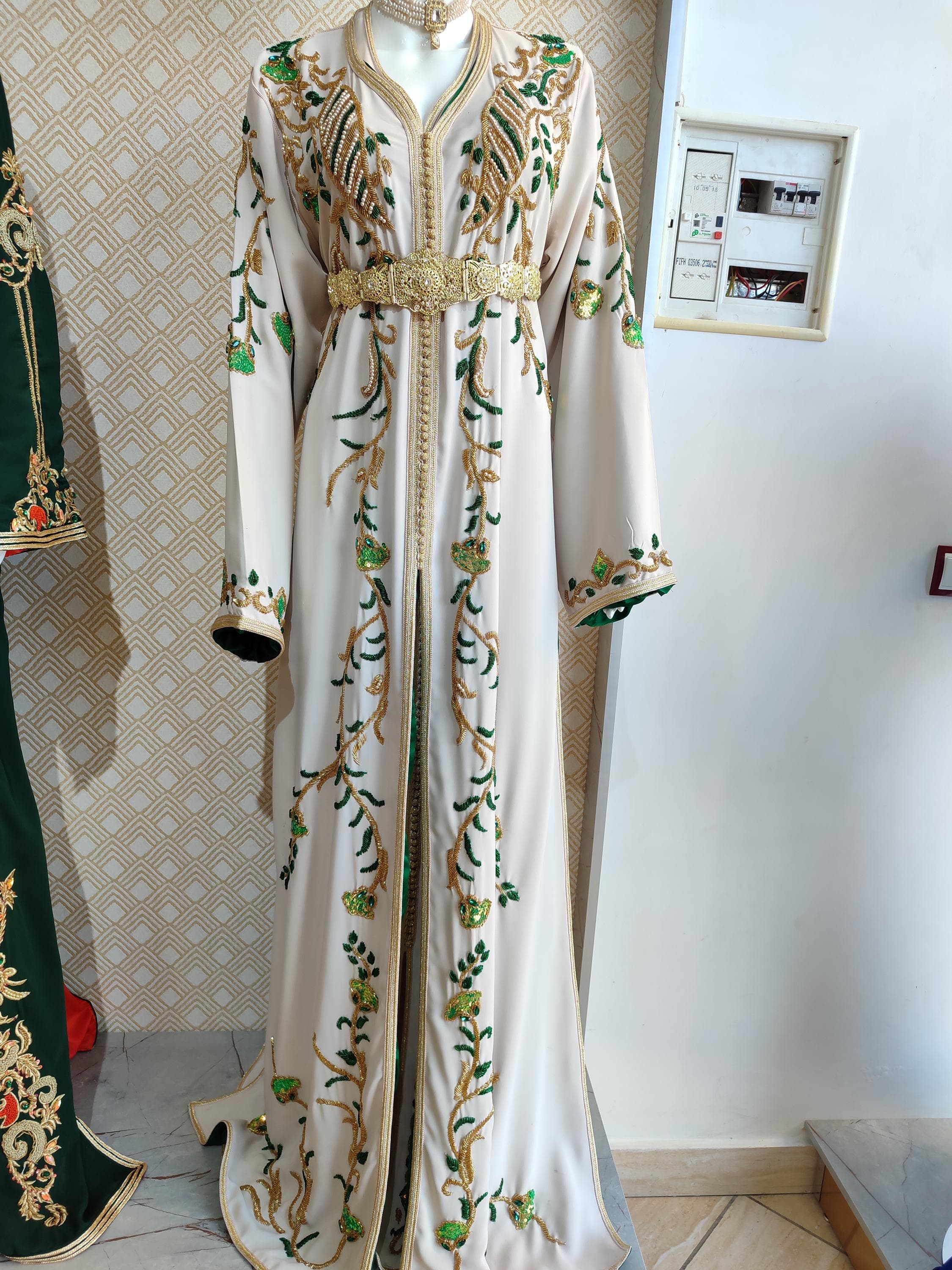 Step into timeless elegance with this Moroccan Takshita Dress, a true fusion of cultural artistry and modern flair. This caftan marocain is handcrafted for brides and women attending special events. Ideal as a bridal kaftan dress or nikah outfit, its refined embroidery and rich fabrics offer a luxurious feel. A perfect choice among muslim dresses for weddings, it reflects grace and heritage.