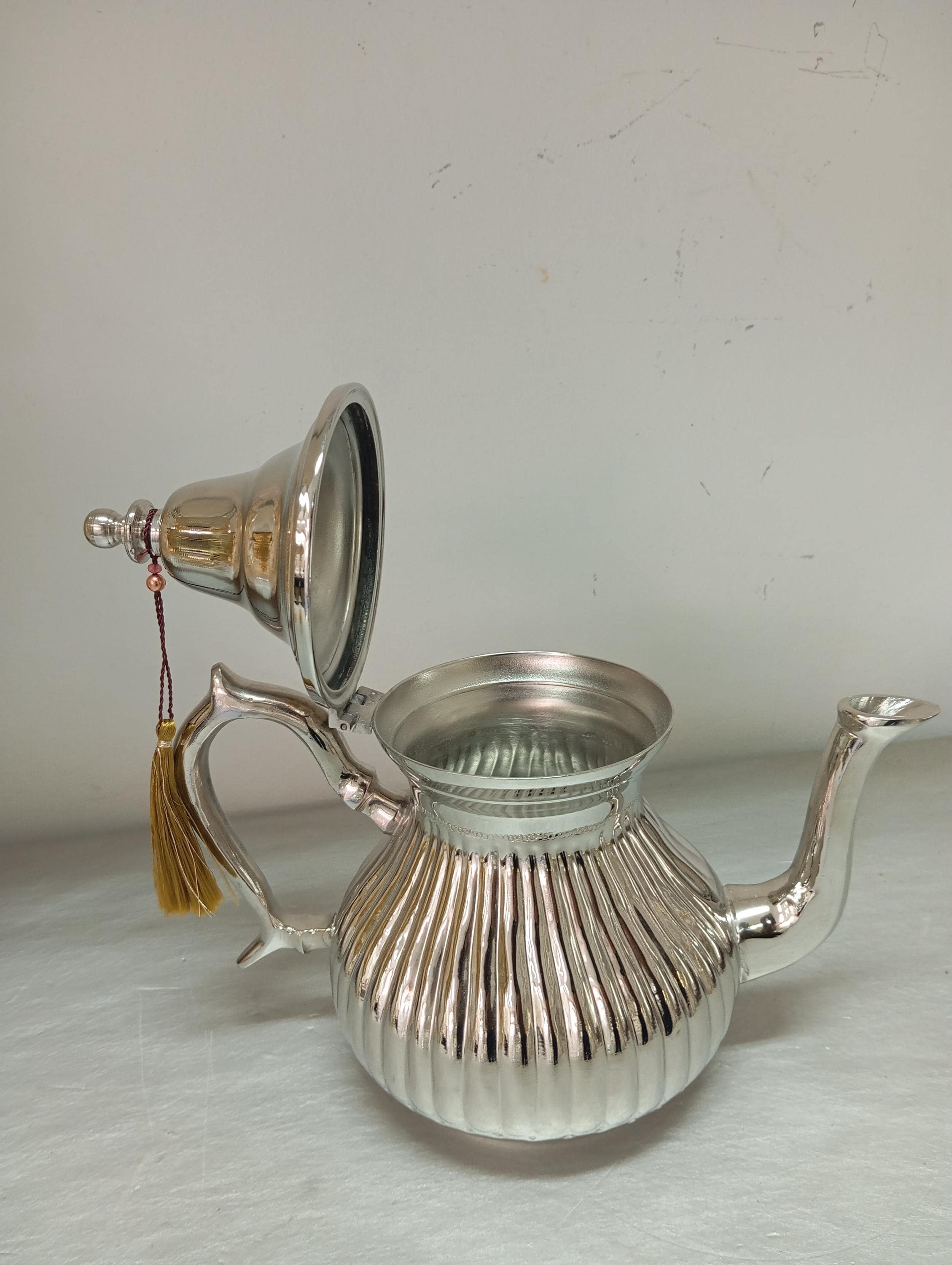 Elevate your tea service with this handmade Moroccan teapot set, a beautifully designed artisanal teapot perfect for any traditional tea set. The intricate details of this Marrakech-inspired teapot bring Moroccan charm to your table, making it an excellent choice for those who appreciate fine craftsmanship.