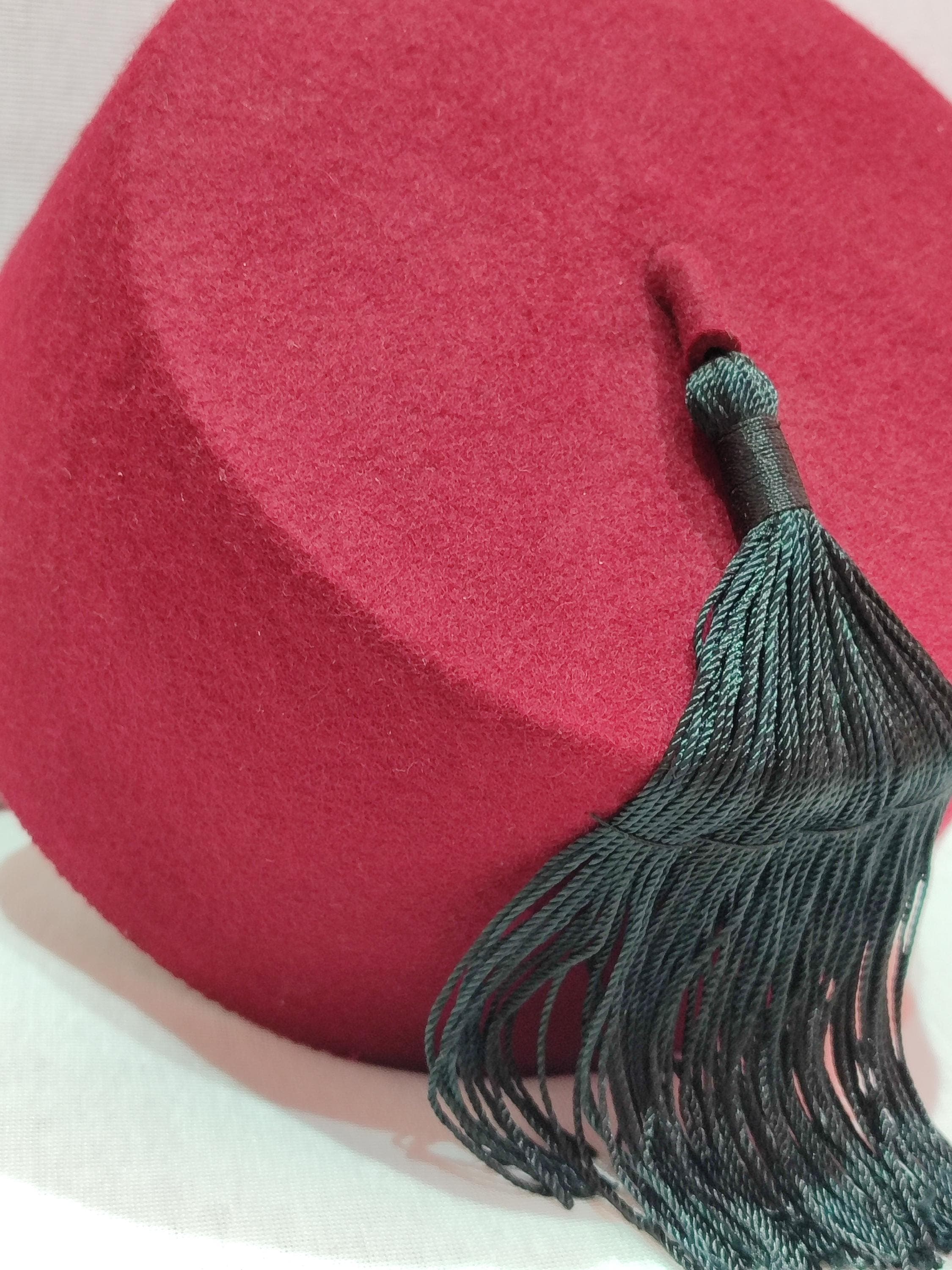 Embrace cultural heritage with our Royal Tarboush, a handcrafted luxury hat designed for discerning individuals. This premium Fez hat showcases exquisite hasira patterns and a refined silk tassel, embodying the essence of Moroccan craftsmanship. Ideal as a kufi cap or Muslim turban, this tarboosh is perfect for weddings, religious gatherings, or as a sophisticated accessory. Its timeless design ensures it remains a cherished piece for years to come.
