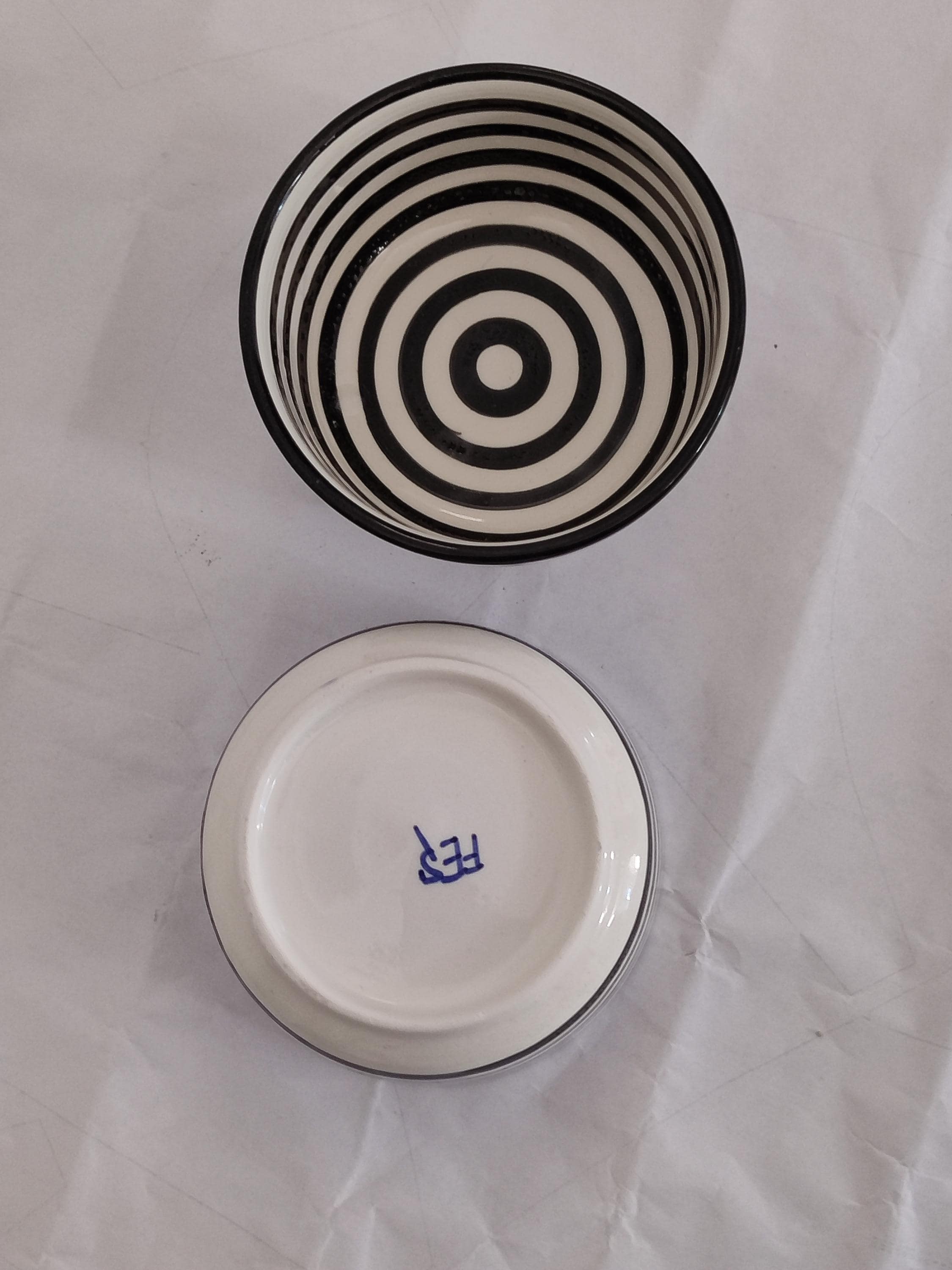 Discover the beauty of handmade Moroccan ceramic bowls with this exquisite set. Each wheel-thrown bowl showcases a unique black and white striped pattern, reflecting the rich heritage of Moroccan pottery. These colorful bowls (in a monochrome palette) are perfect as popcorn bowls, serving bowls, or even as decorative bowls for your countertop. The boho minimalist design pairs well with various table settings, while the durable ceramic material ensures lasting use.