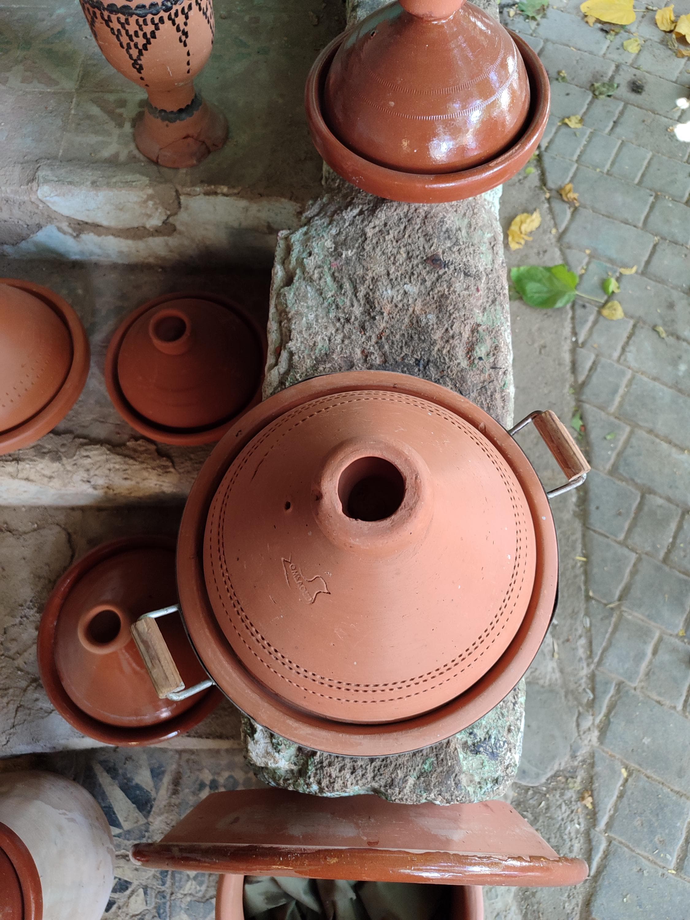 Our large tagine is specially designed for family-sized portions of Moroccan cuisine. The innovative non-stick interior glaze makes cleaning effortless while maintaining authentic clay tagine cooking properties. The generous capacity and durable terracotta construction make this tajine clay pot ideal for entertaining. Includes a matching serving base and comes with traditional Moroccan tagine recipes to get you started. Perfect gift for food lovers seeking authentic Moroccan cookware.