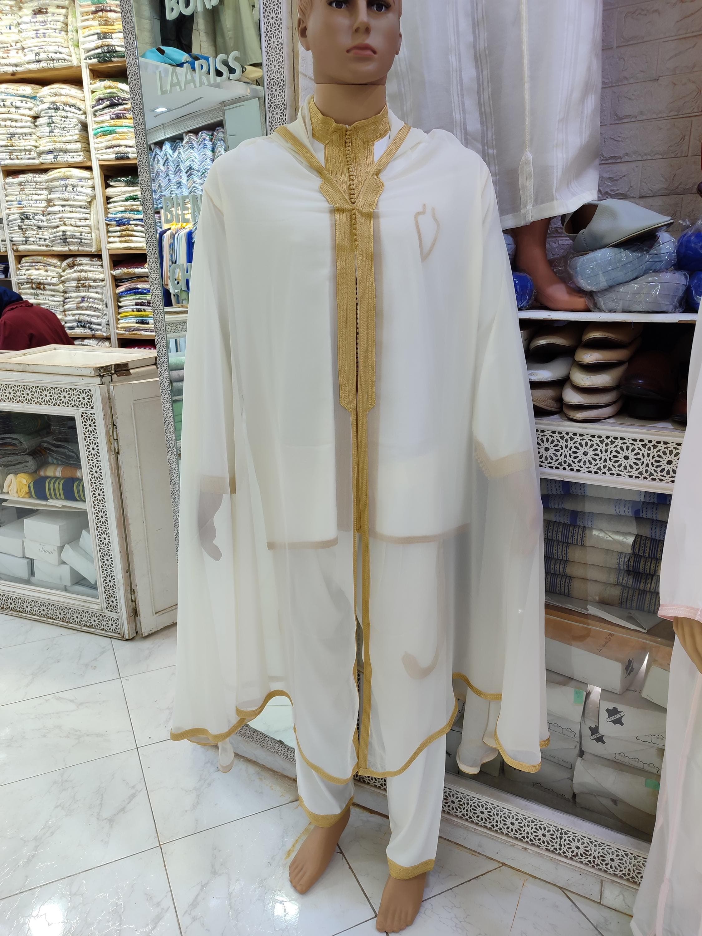 Elevate your wardrobe with this luxurious Moroccan thobe men set, designed for those who appreciate fine details. This jabador men ensemble is perfect for a Moroccan wedding, nikah, or any significant Islamic celebration. The set’s elegant design, featuring traditional embroidery and a comfortable fit, makes it a versatile addition to your Islamic men clothes collection. As a North African robe, it embodies cultural heritage while offering contemporary style