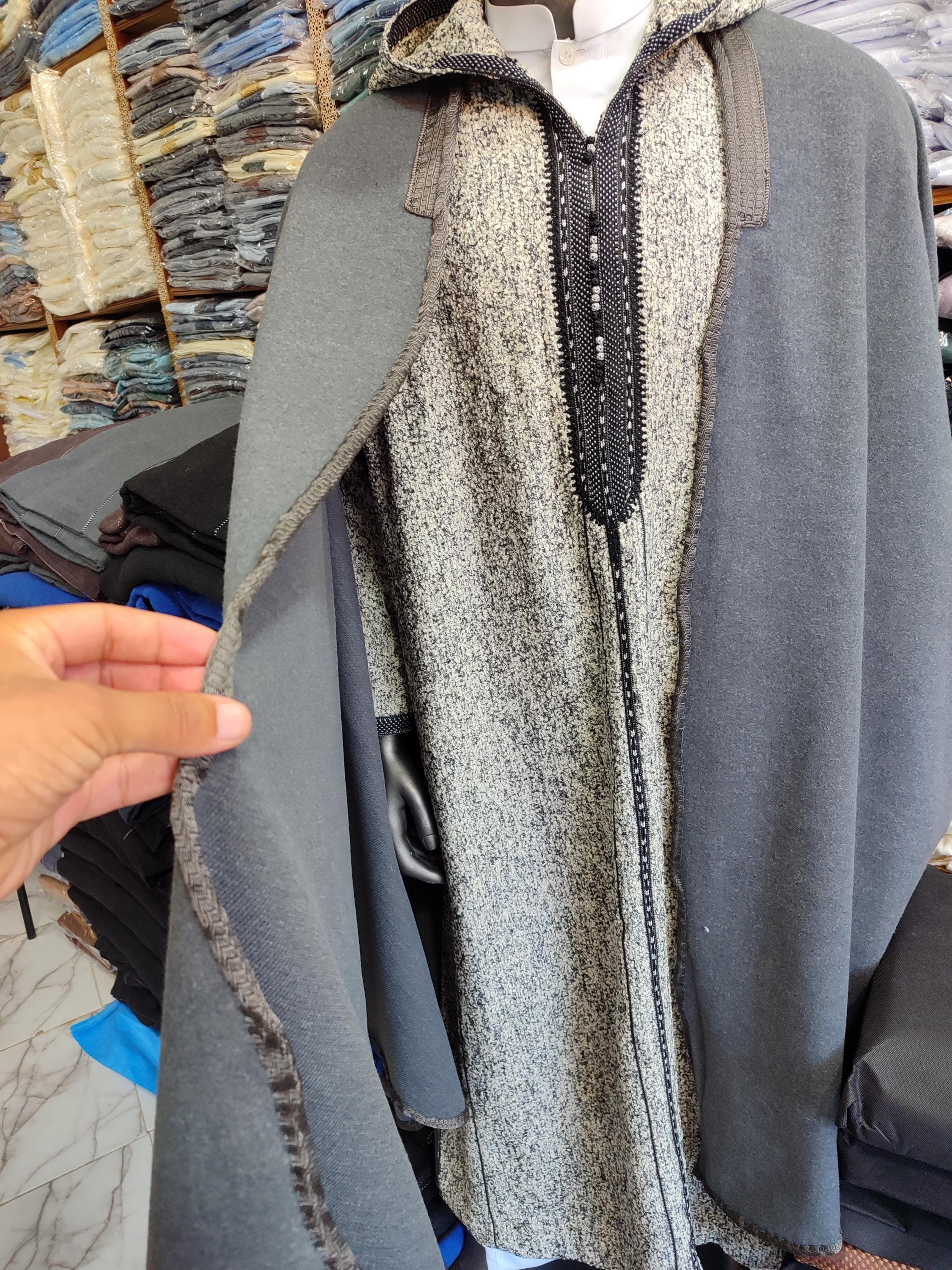 Experience authentic Moroccan winter wear with this Traditional Hooded Djellaba. Crafted from luxurious warm cotton, this winter djellaba men can wear features classic design elements with modern comfort enhancements. The hooded thobe includes traditional embroidery details and a functional hood for added warmth. As both practical winter djellaba and cultural statement piece, this cotton djellaba serves as perfect Moroccan gift men seeking authentic Arabic thobe fashion